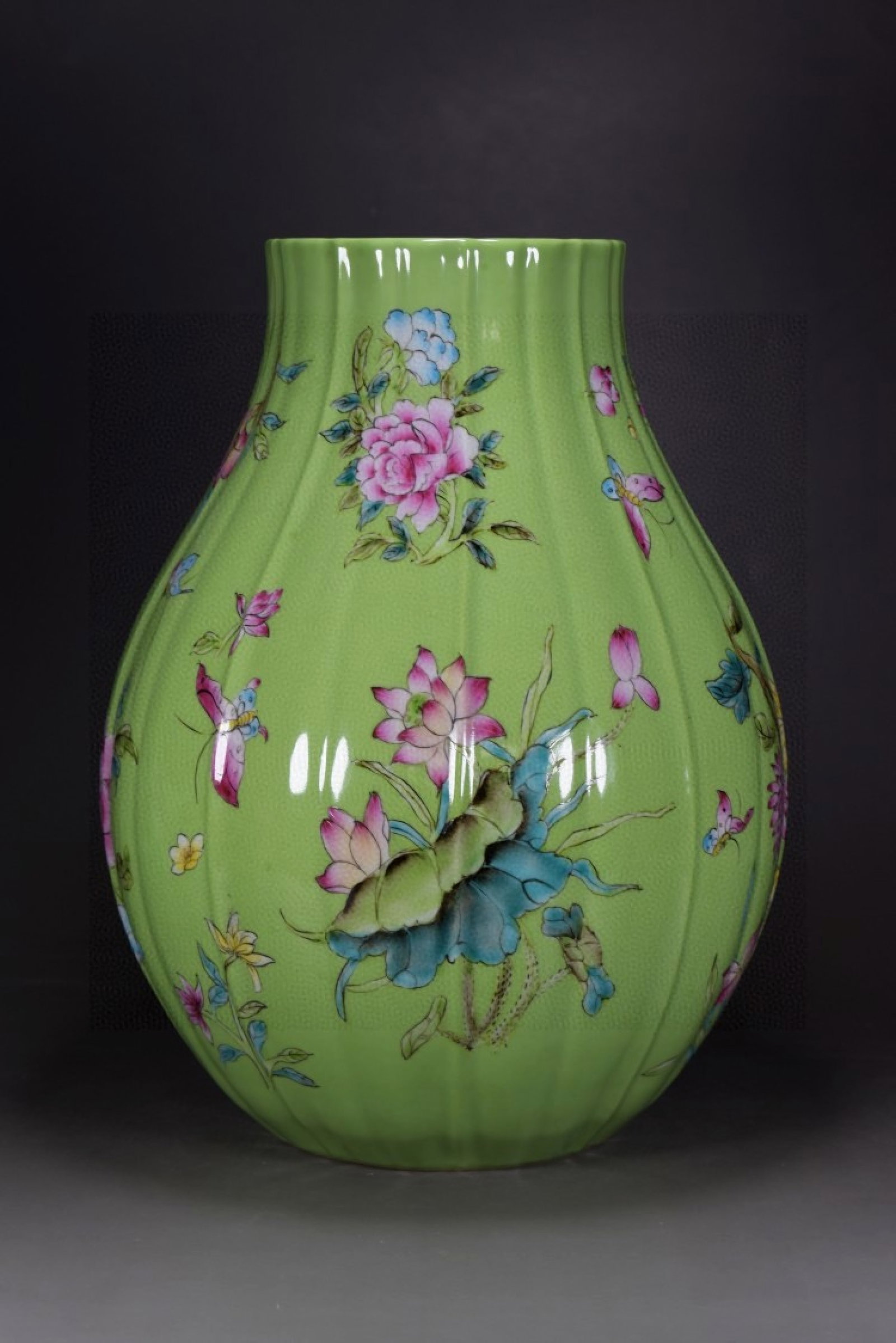 A Rare Green Glazed Famille-Rose Painted Gold Flower and Butterfly Pattern Vase: A Rare Green Glazed Famille-Rose Painted Gold Flower and Butterfly Pattern Vase,Qing Dynasty,China,Qianlong Six-character Mark,Size:13.8inx9.4in