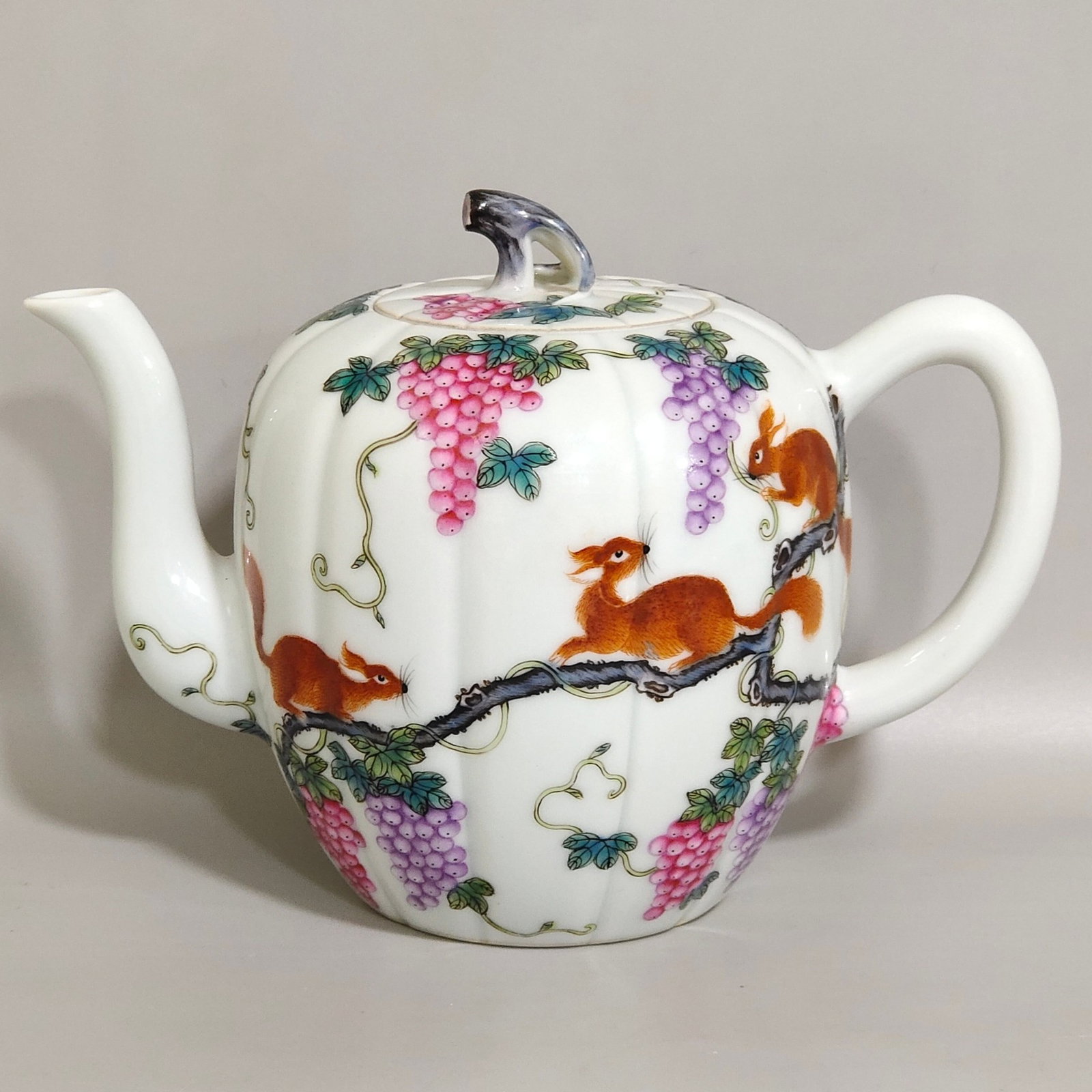 An Exquisite Famille-Rose Squirrel and Grapes Pattern Teapot,With Poem: An Exquisite Famille-Rose Squirrel and Grapes Pattern Teapot,With Poem,Qing Dynasty,China,Qianlong Six-character Mark,Size:4.5inx6.1in