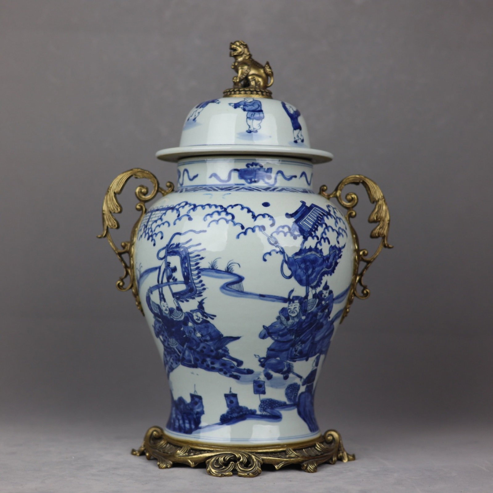 A Huge Blue and White Inlaid Bronze Character and Story Pattern Double-Ears Cover Jar: A Huge Blue and White Inlaid Bronze Character and Story Pattern Double-Ears Cover Jar,Qing Dynasty,China,Kangxi Six-character Mark,Size:16.5inx5.1inx10.6inx8.7in