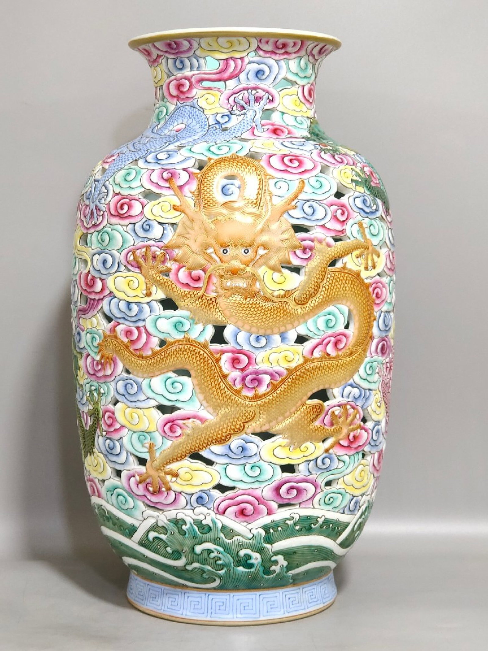 A Rare Enamel Painted Gold Hollow Seawater Auspicious Cloud and Dragon Pattern Vase: A Rare Enamel Painted Gold Hollow Seawater Auspicious Cloud and Dragon Pattern Vase,Qing Dynasty,China,Qianlong Six-character Mark,Size:13.2inx7.1in 珐琅彩描金镂