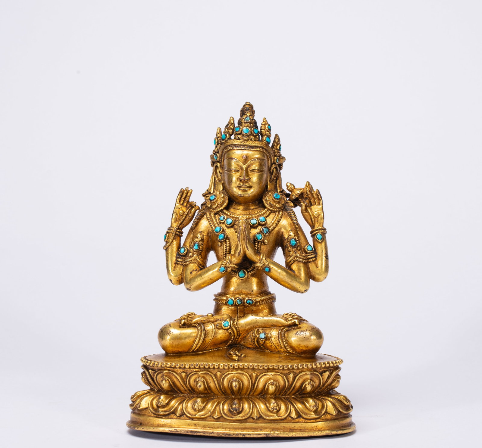 A Solemn Gilt Bronze Statue of Four-Arms Avalokitesvara,Inlaid Turquoise: A Solemn Gilt Bronze Statue of Four-Arms Avalokitesvara,Inlaid Turquoise,Qing Dynasty,China,Size:4.3inx3inx5.9in,Weight:880g
