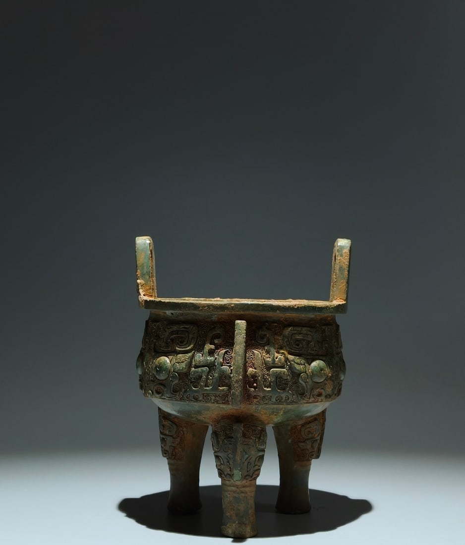 An Archaic Bronze Beast-Face Pattern Double-Ears Tripod Censer: An Archaic Bronze Beast-Face Pattern Double-Ears Tripod Censer,Sang Dynasty,China,Size:7.3inx5.5in