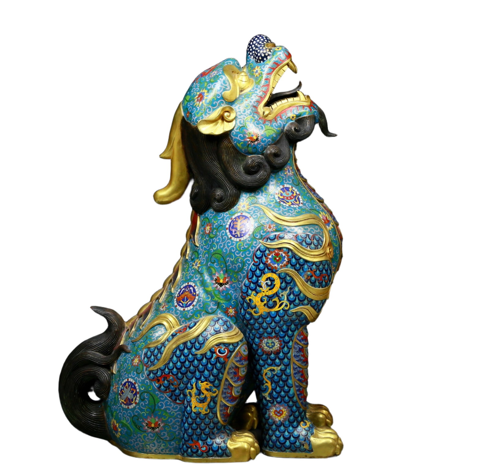 An exquisite cloisonné unicorn ornament: A cloisonné unicorn ornament Qing Dynasty, China. The unicorn is lifelike and graceful, seeming to convey a message of auspiciousness and protection. The cloisonné blue background is dotted 