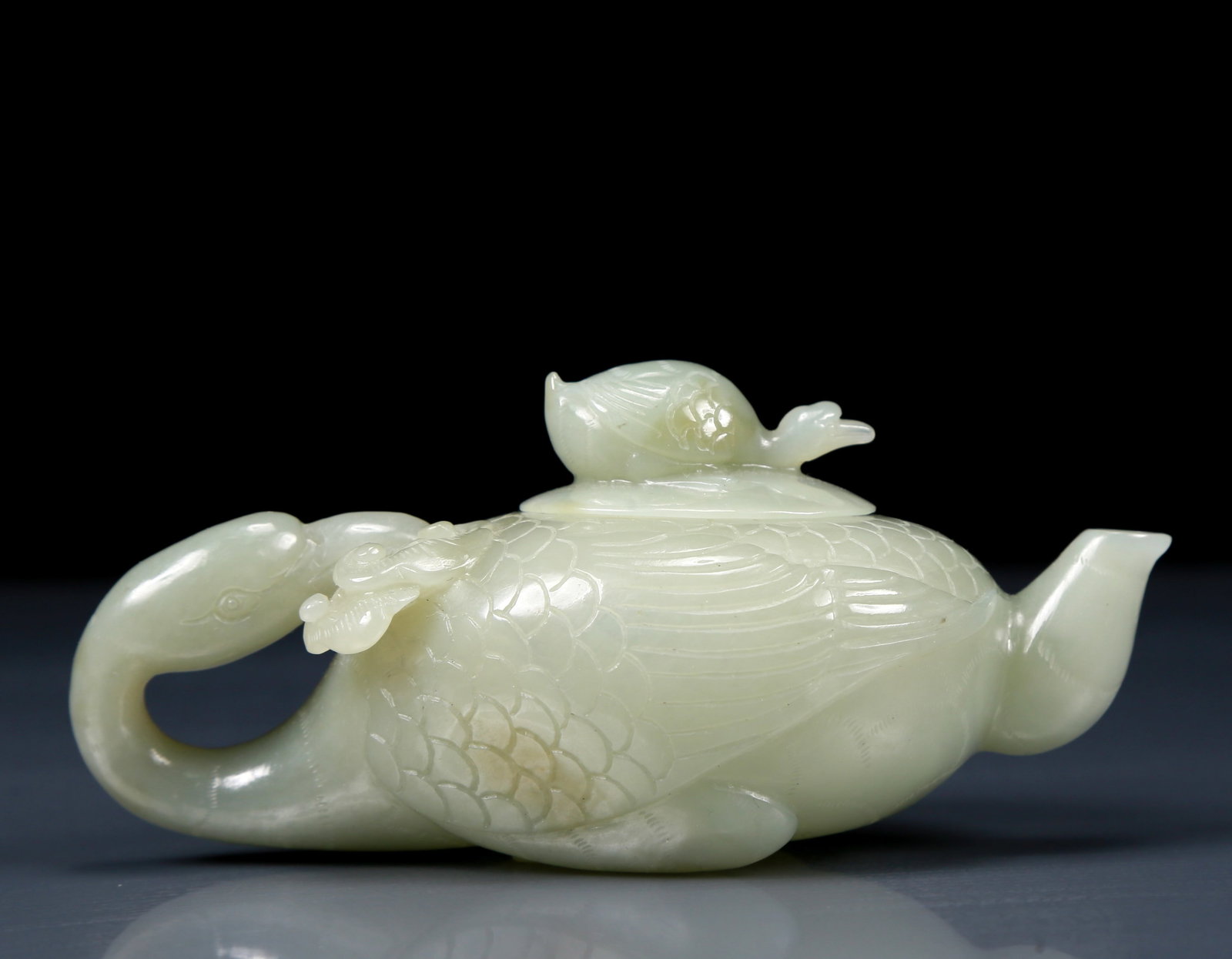 An Exquisite Greenish Jade Goose Teapot: An Exquisite Greenish Jade Goose Teapot ，Qing Dynasty, China，Size:4.7inx2.4inx2.2in，Weight:140g 青白玉鸭形茶壶，清代