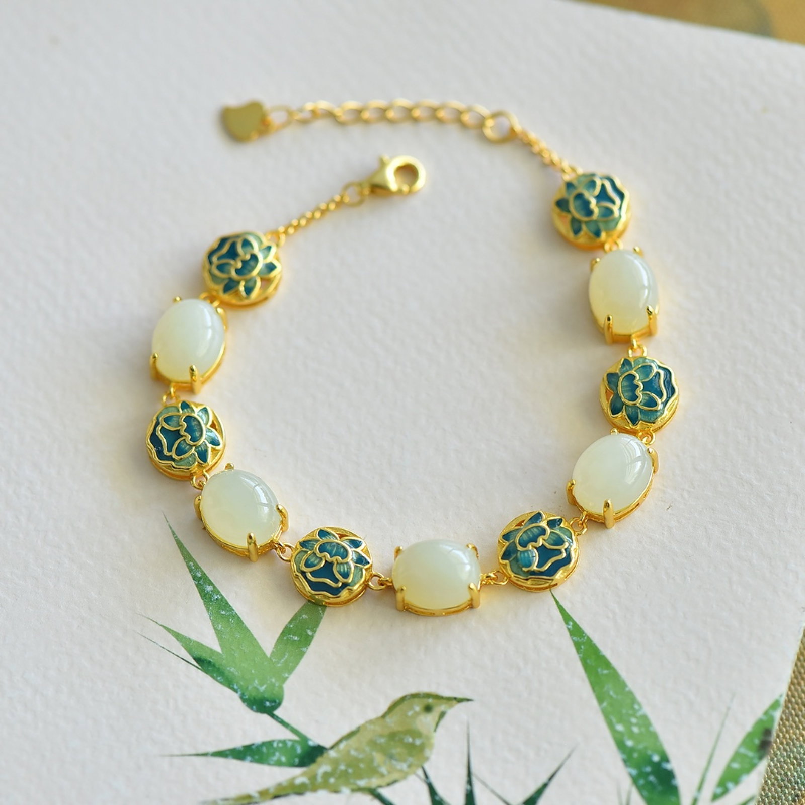 An Exquisite Sterling Silver-Gold Plated Inlaid White Jade Enamel Bracelets: An Exquisite Sterling Silver-Gold Plated Inlaid White Jade Enamel Bracelets 纯银镀金镶白玉珐琅手链