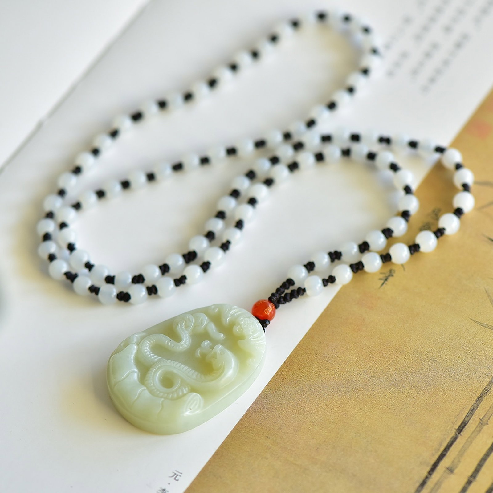 An Exquisite White Jade Snake Pattern Pendant: An Exquisite White Jade Snake Pattern Pendant,Size:45mmx30mm 白玉蛇纹吊坠