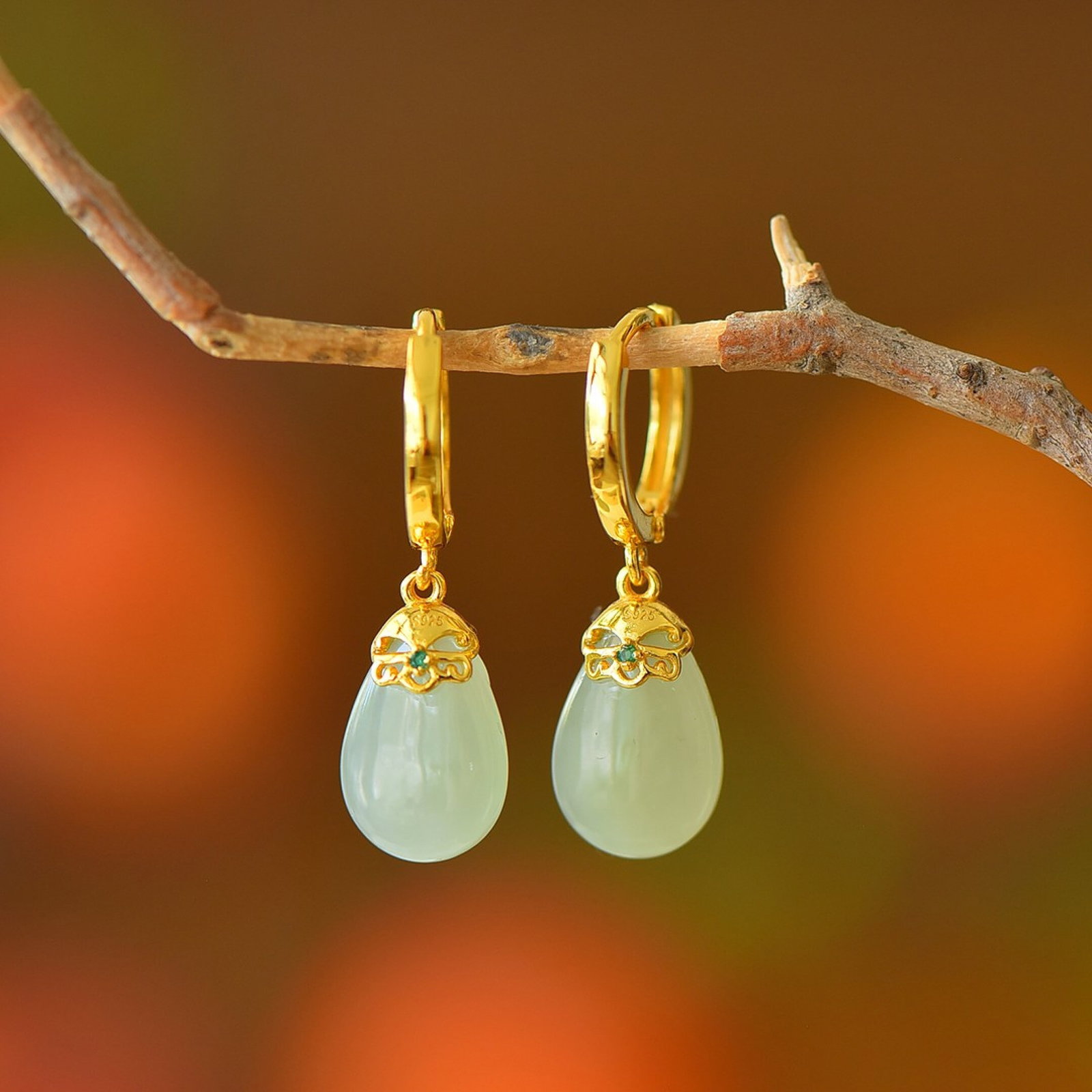 A Pair of Exquisite Sterling Silver-Gold Plated Inlaid White Jade Earrings: A Pair of Exquisite Sterling Silver-Gold Plated Inlaid White Jade Earrings,Size:9mmx14mm 一对纯银镀金镶白玉耳环