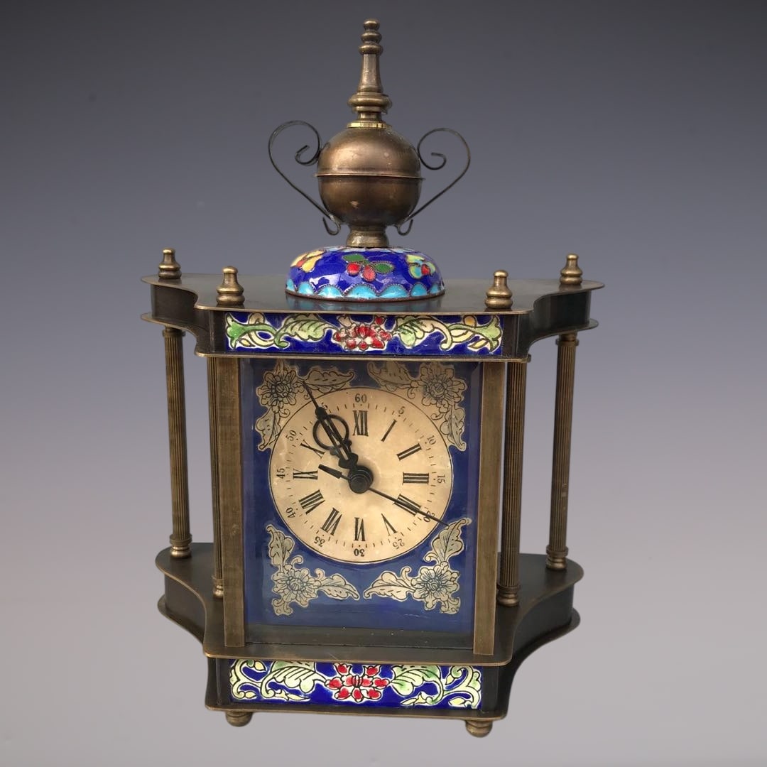 An Exquisite Bronze Lotus Pattern Clock: An Exquisite Bronze Lotus Pattern Clock Qing Dynasty, China Size:5.9inx3.1inx8.7in铜缠枝莲纹钟表 中国清代 Size:15cmx8cmx22cm