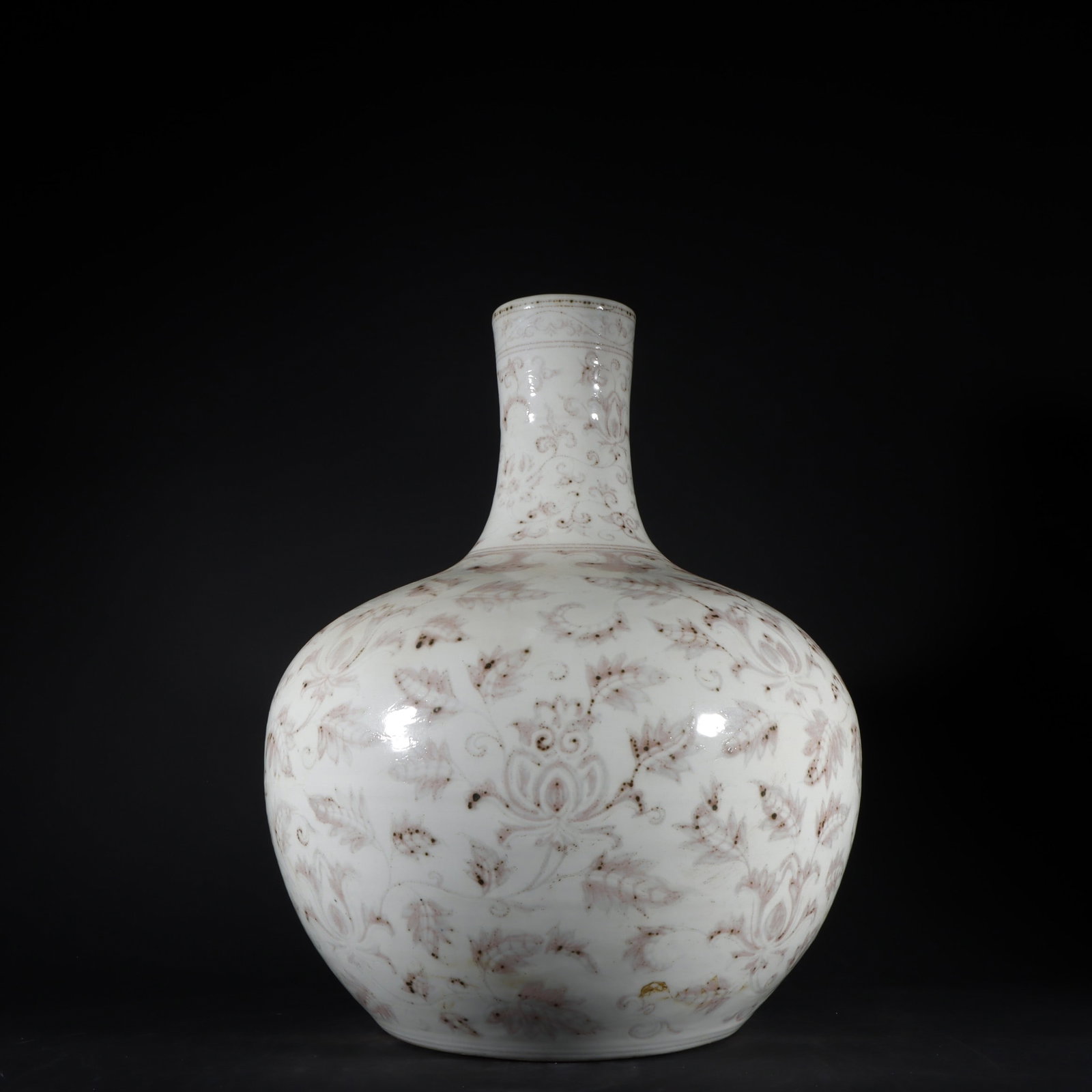 An Exquisite Underglaze-Red Lotus Pattern Vase: An Exquisite Underglaze-Red Lotus Pattern Vase Ming Dynasty, China Size:16.5inx13.6in釉里红缠枝花卉纹天球瓶