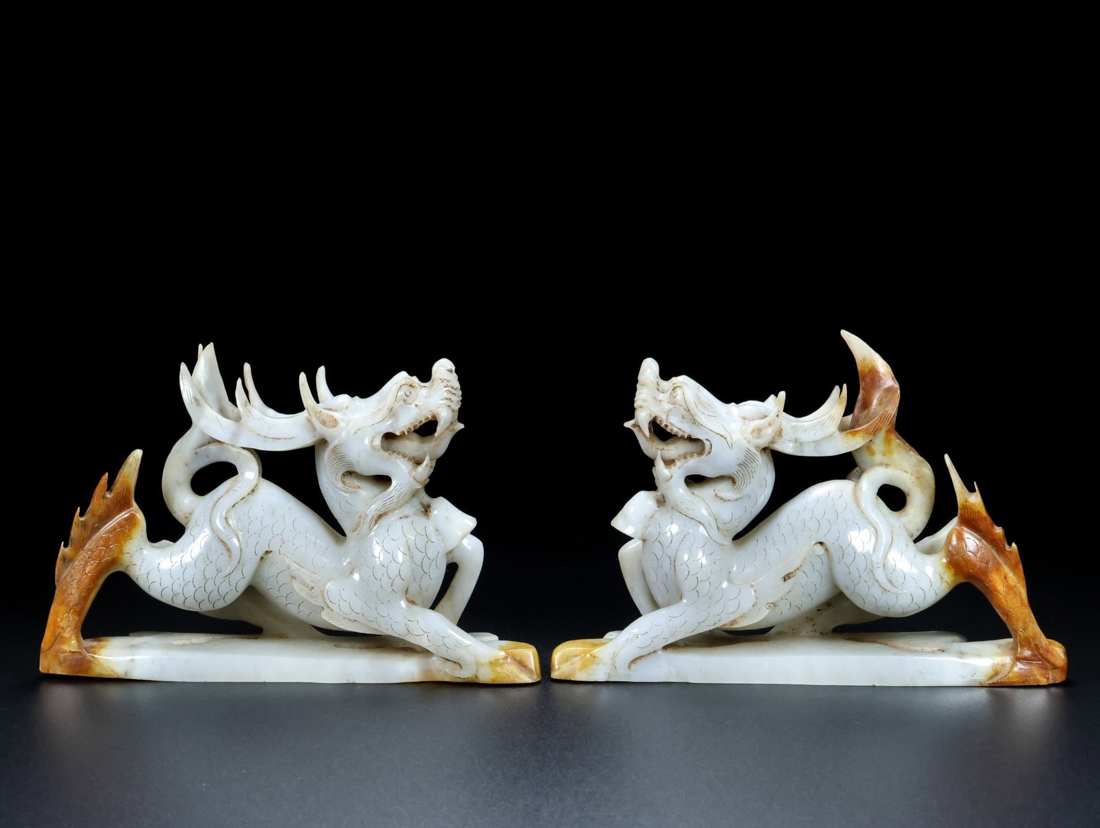 A Pair of Exquisite White Jade Kylin: A Pair of Exquisite White Jade Kylin Qing Dynasty, China Size:4.7inx6.7inx2in Total Weight:1017g白玉麒麟一对 中国清代 Size:12cmx17cmx5cm