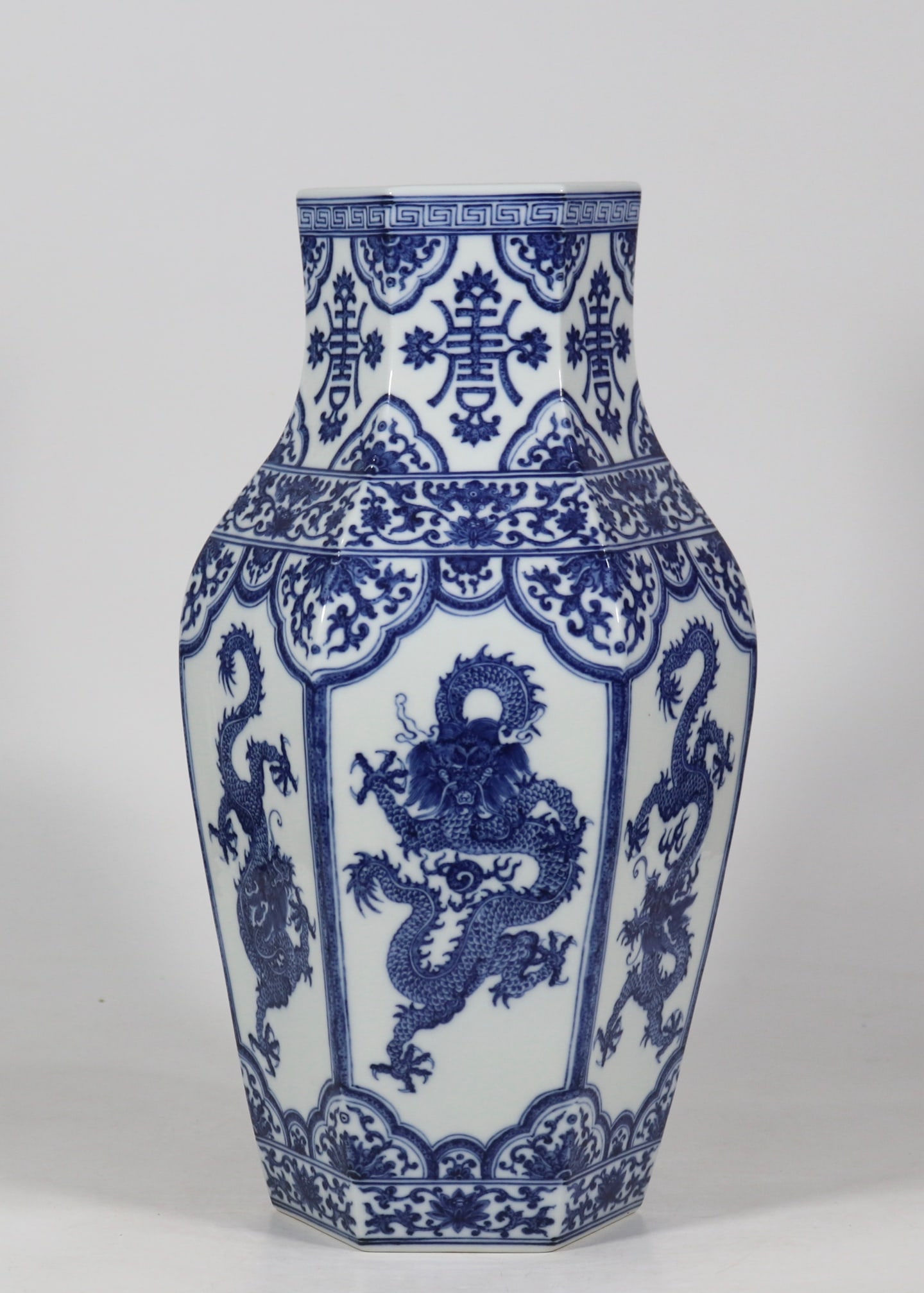 An Exquisite Blue and White Dragon Pattern Lotus Pattern Vase: An Exquisite Blue and White Dragon Pattern Lotus Pattern Vase Qing Dynasty, China Yongzheng Six-character Mark Size:15.6inx7.9in青花六龙六方观音瓶