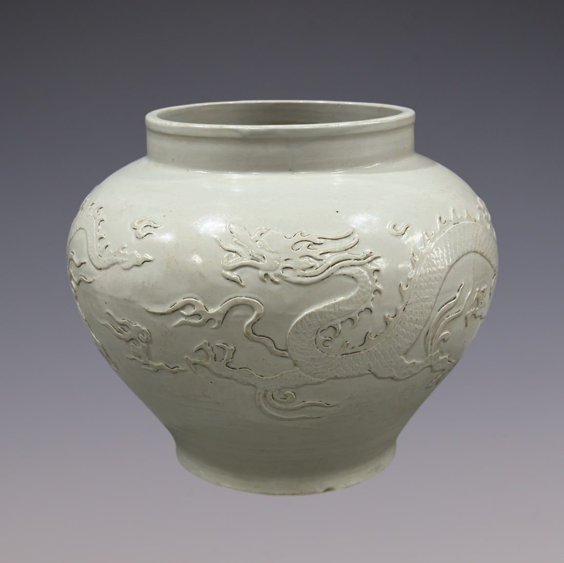 An Exquisite Shufu Glazed Dragon Pattern Jar: An Exquisite Shufu Glazed Dragon Pattern Jar Yuan Dynasty, China Size:11.4in枢府窑卵白釉龙纹瓶罐 中国元代 Size:29cm