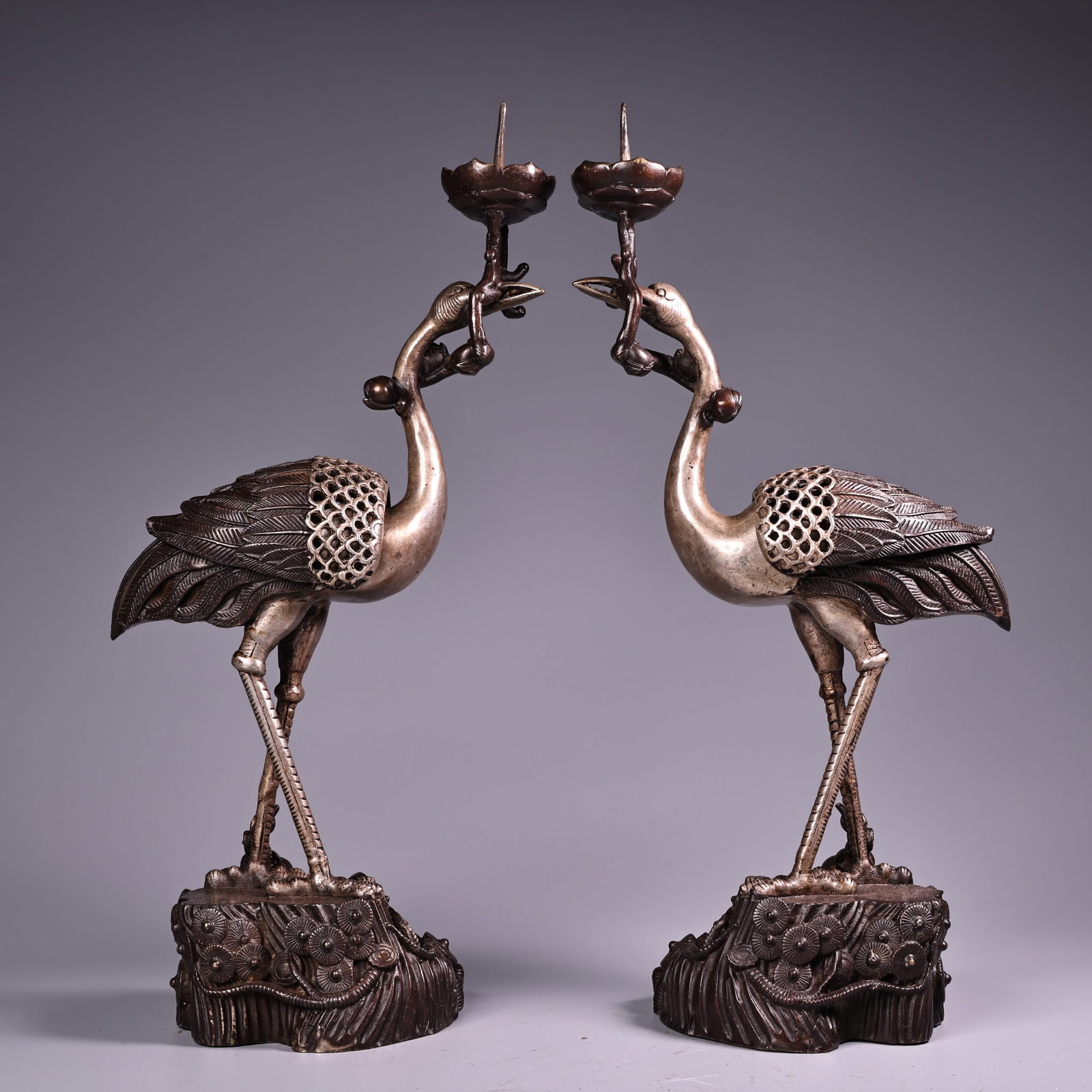 A Pair of Exquisite Silver Bronze Crane-Shaped Candlestick: A Pair of Exquisite Silver Bronze Crane-Shaped Candlestick Qing Dynasty, China Size:11.8inx4.7in Weight:700g铜鎏银鹤烛台一对