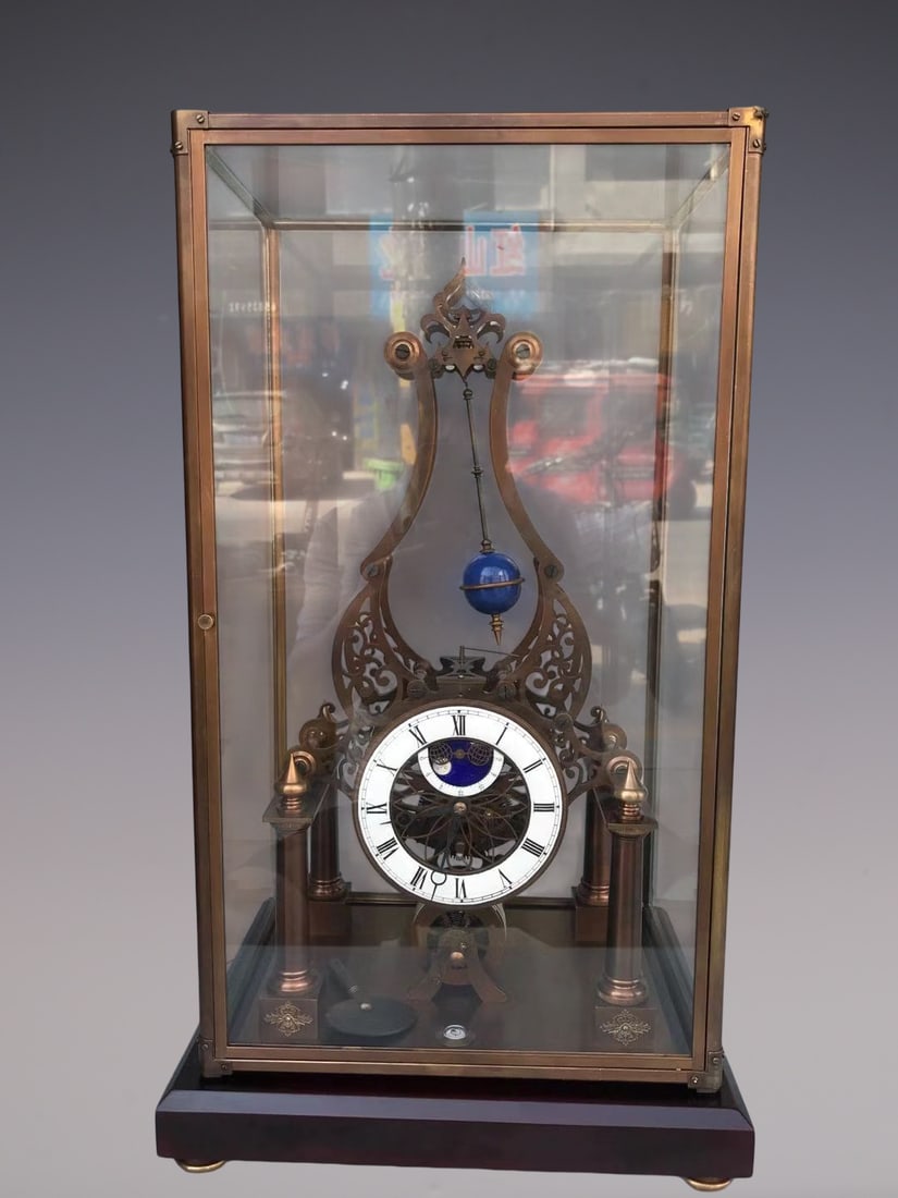 An Exquisite Bronze Clock: An Exquisite Bronze Clock Qing Dynasty, China Size:22.8inx13inx10.2in铜钟表 中国清代 Size:58cmx33cmx26cm