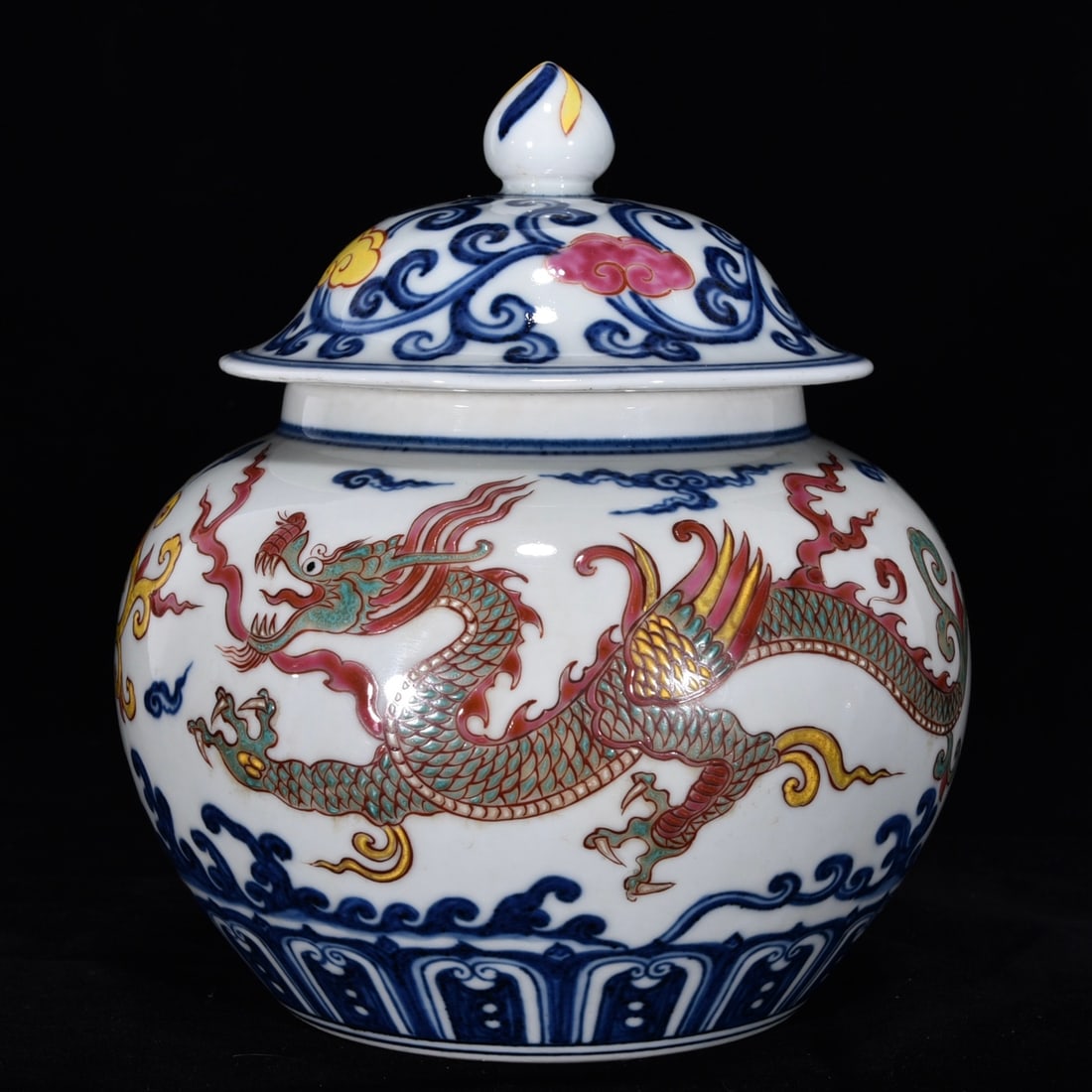 An Exquisite Wucai Blue and White Dragon Pattern Lotus Pattern Jar: An Exquisite Wucai Blue and White Dragon Pattern Lotus Pattern Jar Ming Dynasty, China Xuande Six-character Mark Size:7.5inx6.7in青花五彩龙纹盖罐 ߑ