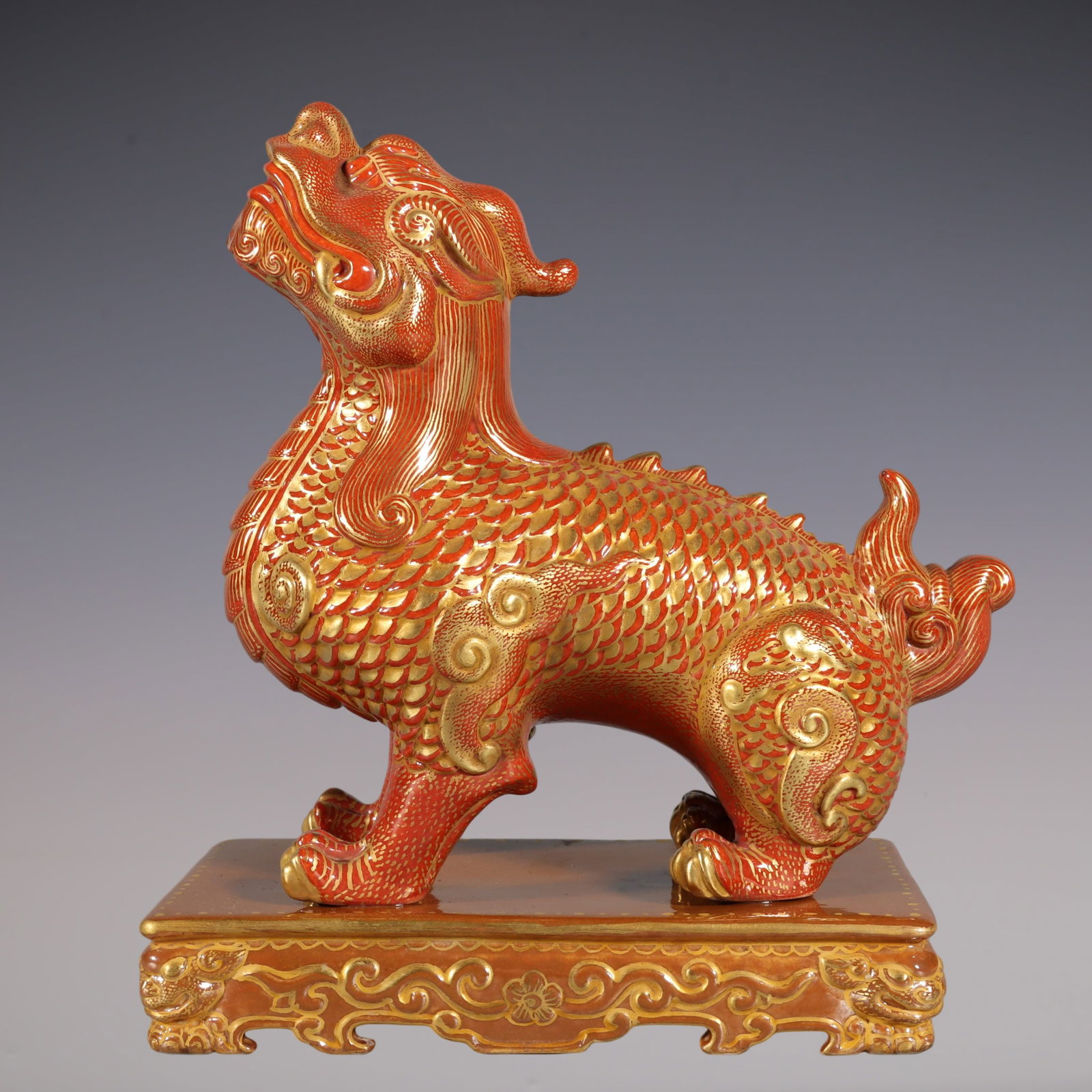 An Exquisite Iron-Red Painted Gold Kylin Paper Weight: An Exquisite Iron-Red Painted Gold Kylin Paper Weight Qing Dynasty, China Qianlong Six-character Mark Size:5.7inx4.3inx2.3in沙红描金麒麟镇纸 中