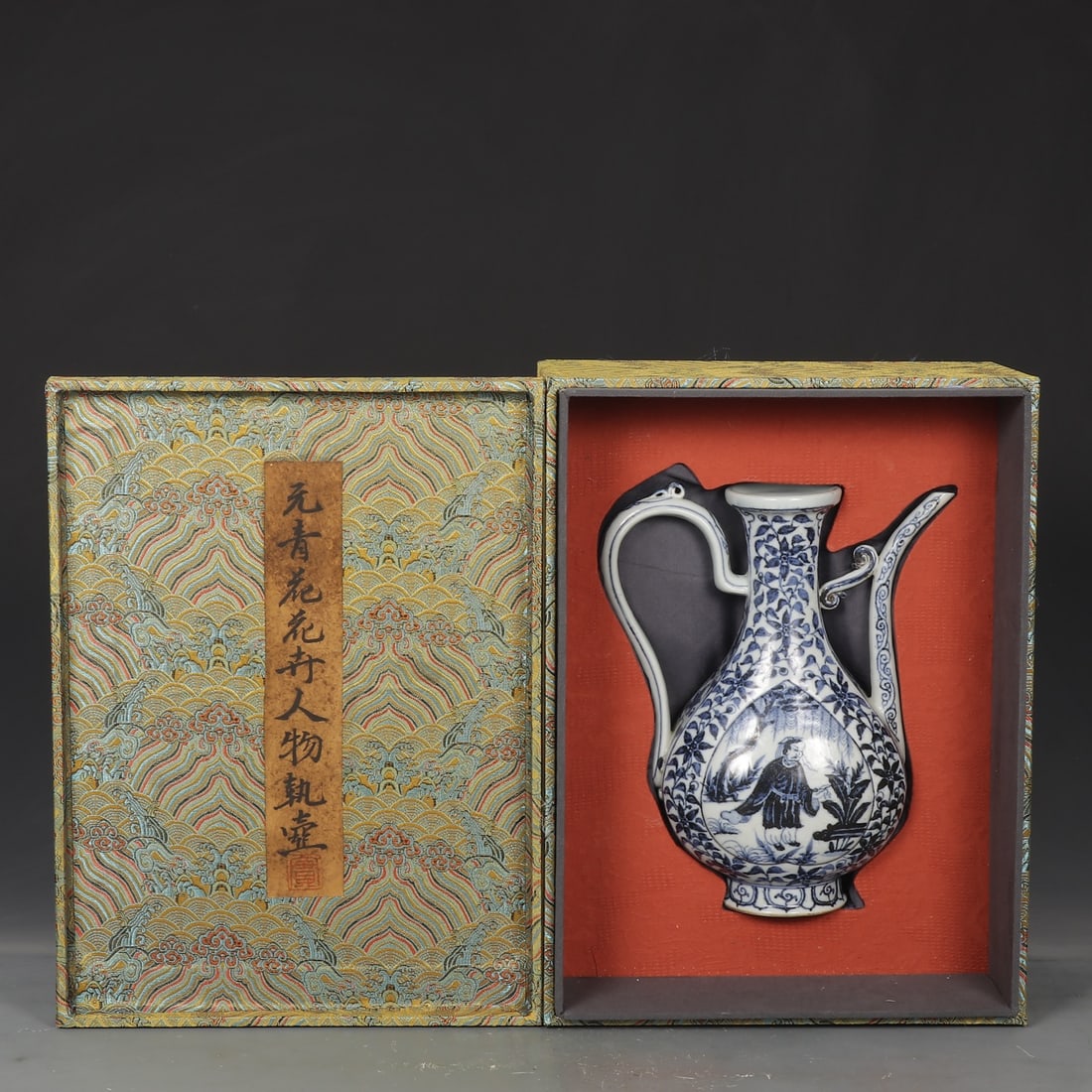 An Exquisite Blue and White Flower Pattern Character and Story Pattern Ewer: An Exquisite Blue and White Flower Pattern Character and Story Pattern Ewer Yuan Dynasty, China Size:9.8inx5.5in青花花卉人物执壶 中国元