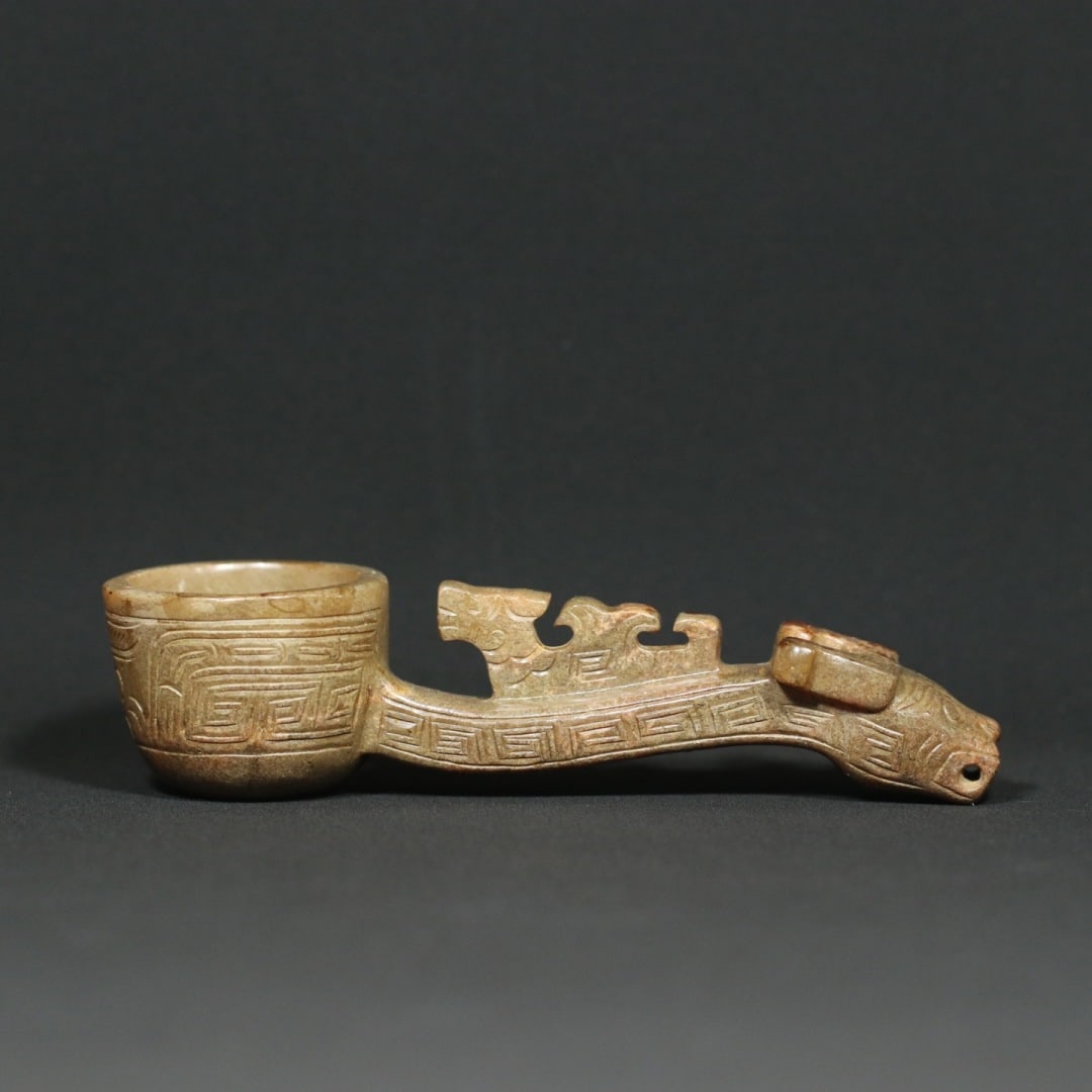 An Exquisite White Jade Beast-Face Pattern Spoon: An Exquisite White Jade Beast-Face Pattern Spoon W.Zhou , China Size:1.4inx1.3inx1.7in Weight:133.8g白玉牛头兽面纹勺子