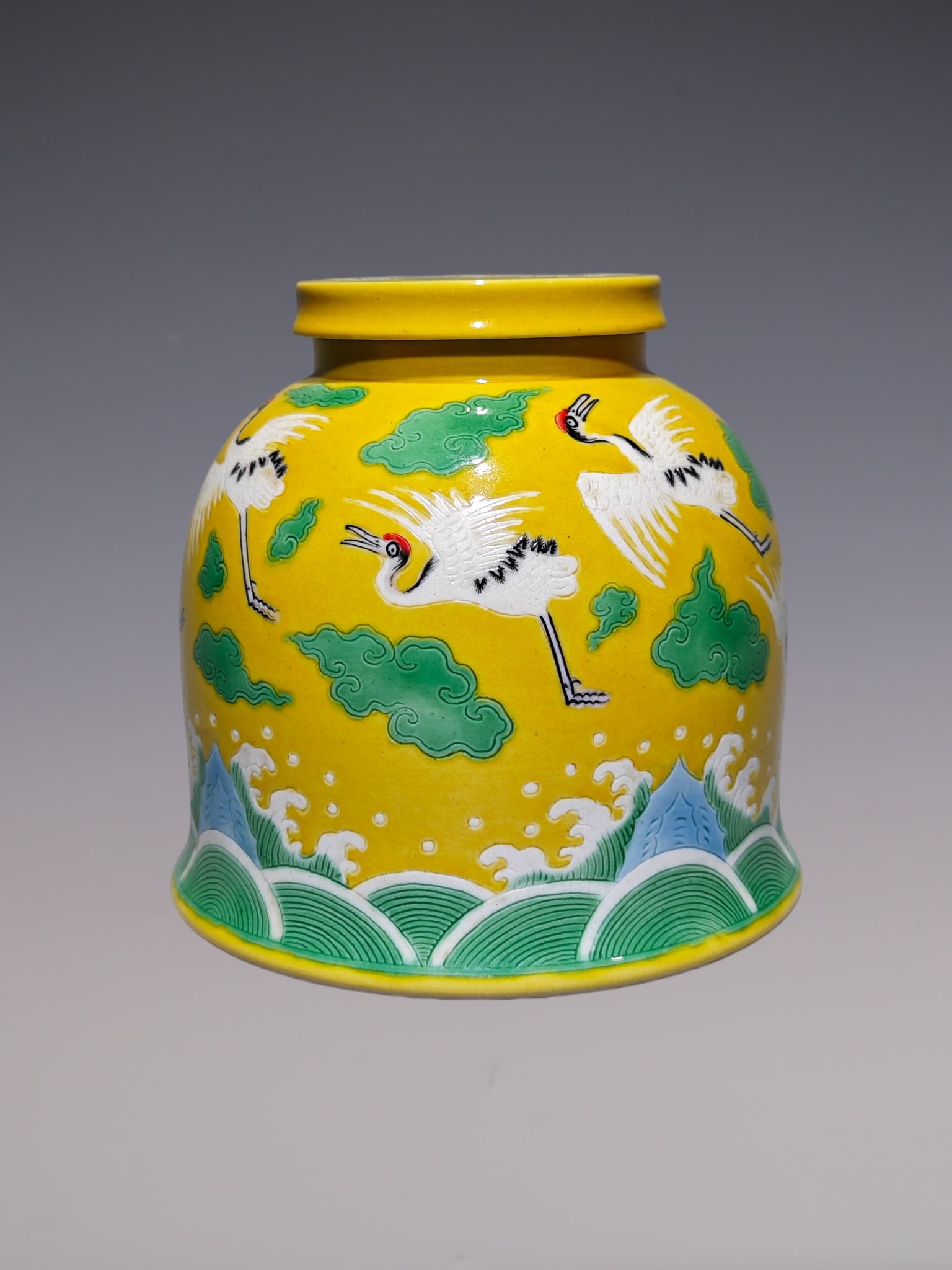 An Exquisite Biscuit Crane Pattern Seawater Pattern Jar: An Exquisite Biscuit Crane Pattern Seawater Pattern Jar Qing Dynasty, China Qianlong Six-character Mark Size:5.5inx5.5in素三彩暗刻云鹤金钟罐
