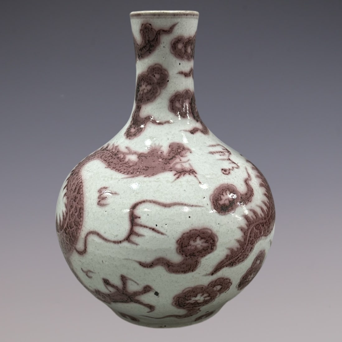 An Exquisite Blue and White Underglaze-Red Dragon Pattern Vase: An Exquisite Blue and White Underglaze-Red Dragon Pattern Vase Yuan Dynasty, China Size:17.5in青花釉里红龙纹天球瓶