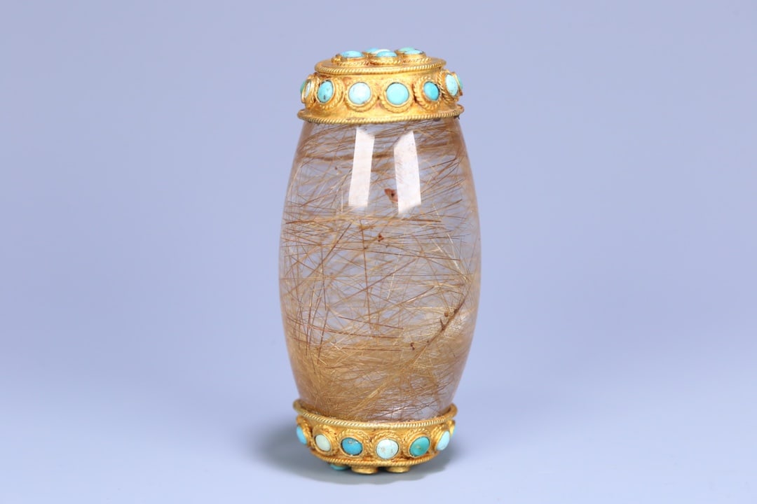 An Exquisite Crystal Inlaid Gilt Bronze Ornament: An Exquisite Crystal Inlaid Gilt Bronze Ornament Qing Dynasty, China Size:3inx1.5in Weight:163g发晶包铜鎏金镶松石供珠