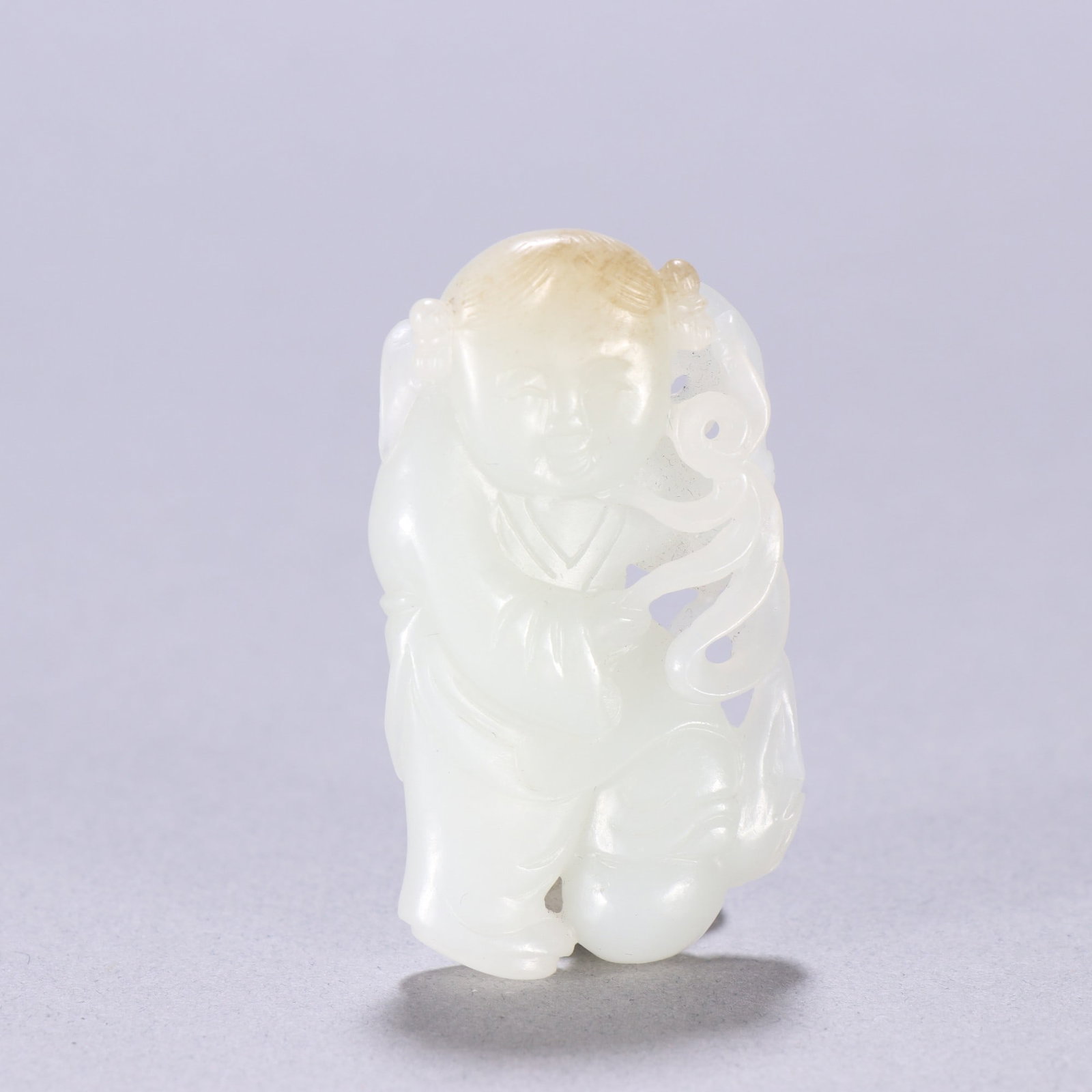 An Exquisite White Jade Figure Pattern Ornament: An Exquisite White Jade Figure Pattern Ornament Qing Dynasty, China Size:2inx1.1in Weight:23.8g白玉童子佩 中国清代 Size:5.2cmx2.9cm Weight:23.8g