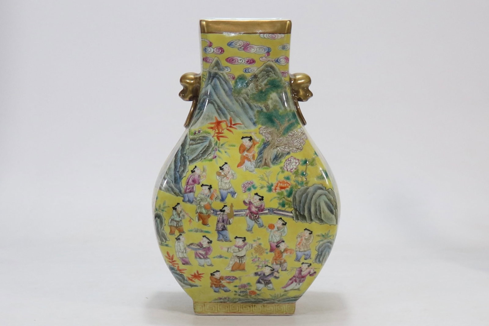 An Exquisite Famille-Rose Character and Story Pattern Double-Ears Vase: An Exquisite Famille-Rose Character and Story Pattern Double-Ears Vase Qing Dynasty, China Qianlong Six-character Mark Size:12.3inx3.7in黄地粉彩百子图兽