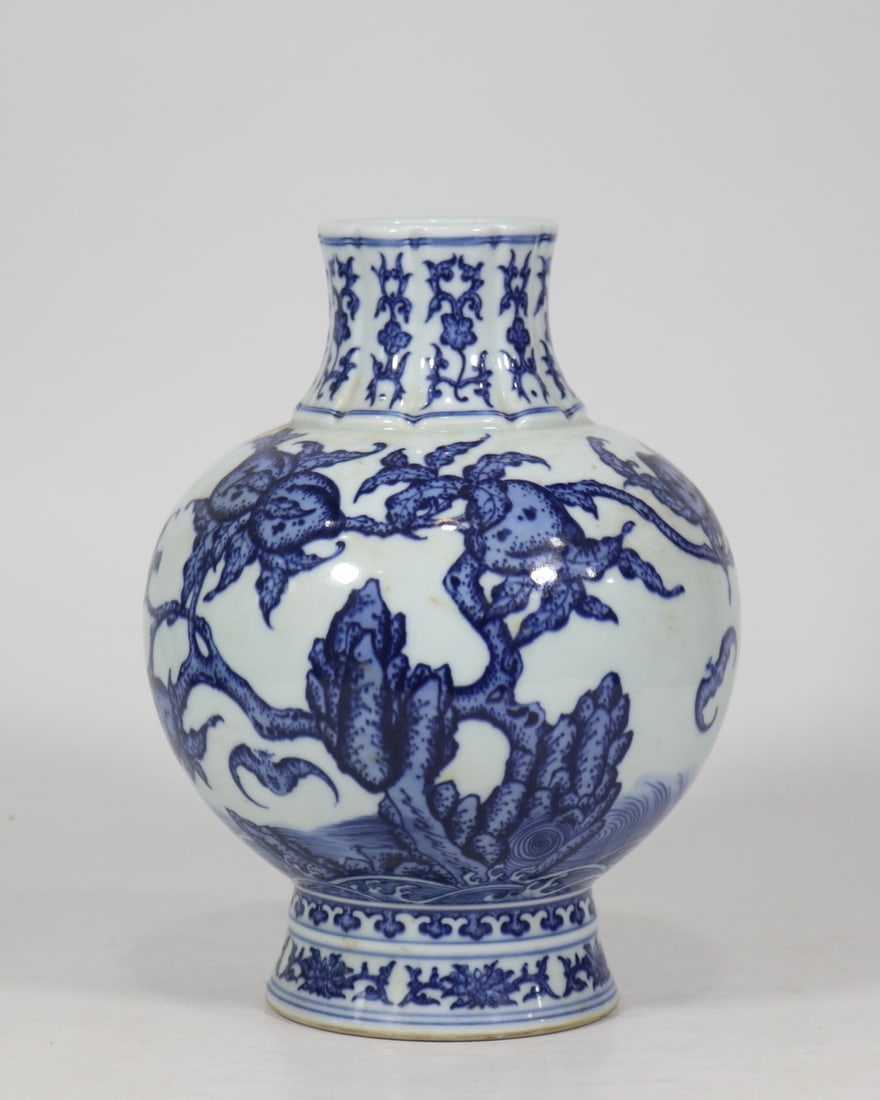 An Exquisite Blue and White Bats and Peach Pattern Vase: An Exquisite Blue and White Bats and Peach Pattern Vase Qing Dynasty, China Qianlong Six-character Mark Size:9.8inx6.9in青花蝙蝠寿桃纹瓜棱瓶