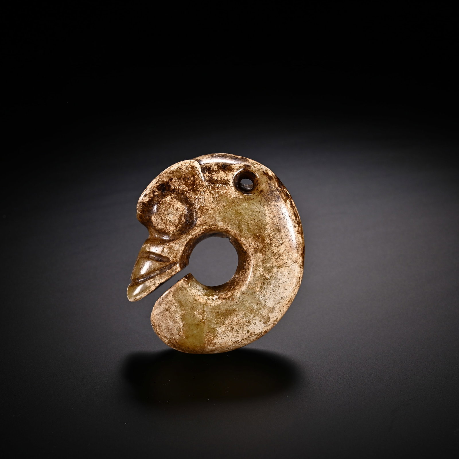An Exquisite White Jade 'Boar& Dragon' Pendant: An Exquisite White Jade 'Boar& Dragon' Pendant Han Dynasty, China Size:2inx1.7in Weight:45g白玉猪龙挂件 中国汉代 Size:5cmx4.4cm Weight:45g