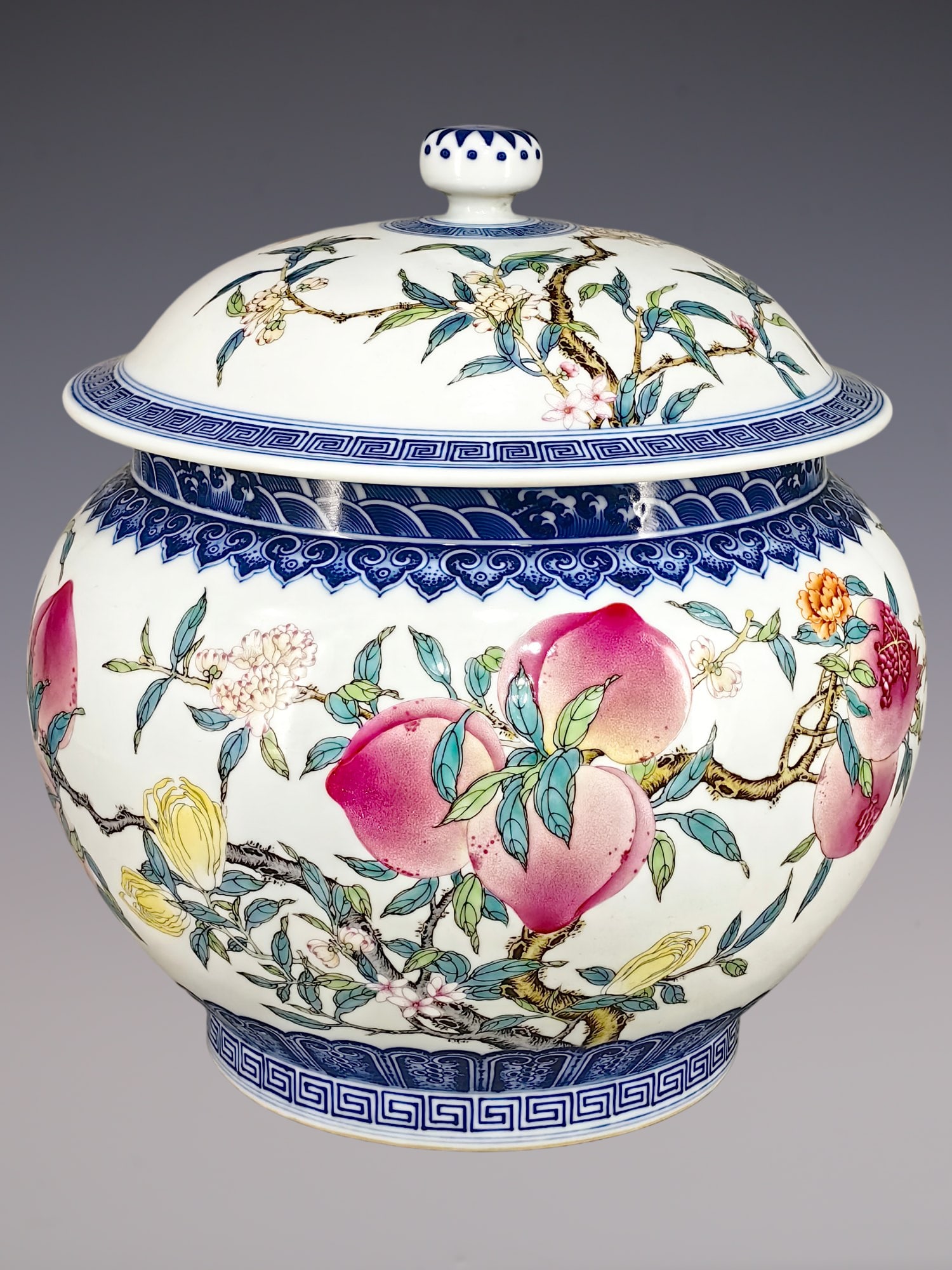 An Exquisite Famille-Rose Flower and Fruit Pattern Jar: An Exquisite Famille-Rose Flower and Fruit Pattern Jar Qing Dynasty, China Qianlong Six-character Mark Size:12.6inx12.6in粉彩三果纹盖罐