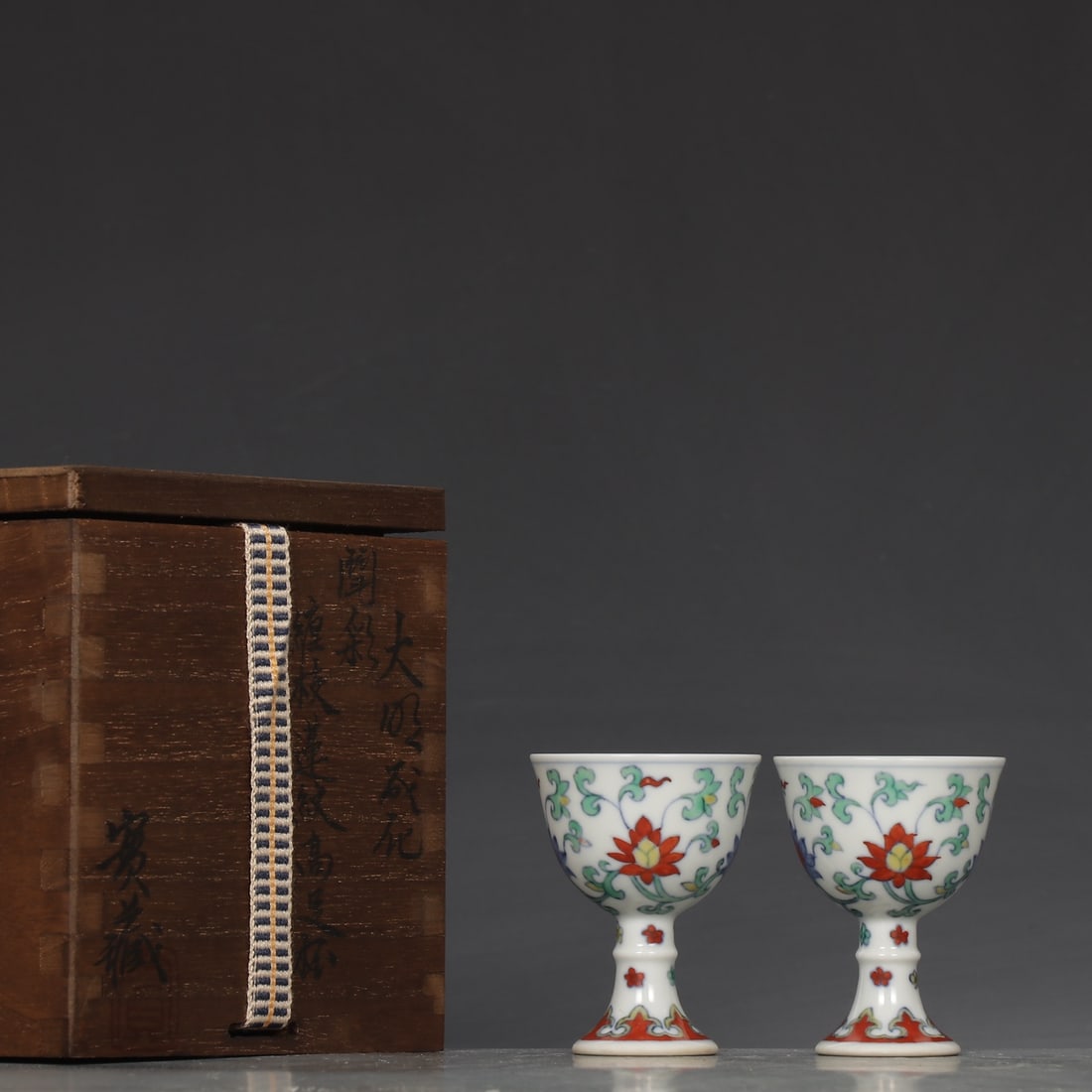 A Pair of Exquisite Doucai Lotus Pattern Cup: A Pair of Exquisite Doucai Lotus Pattern Cup Ming Dynasty, China Chenghua Six-character Mark Size:2.4inx1.9in斗彩缠枝莲纹高足杯一对 &#