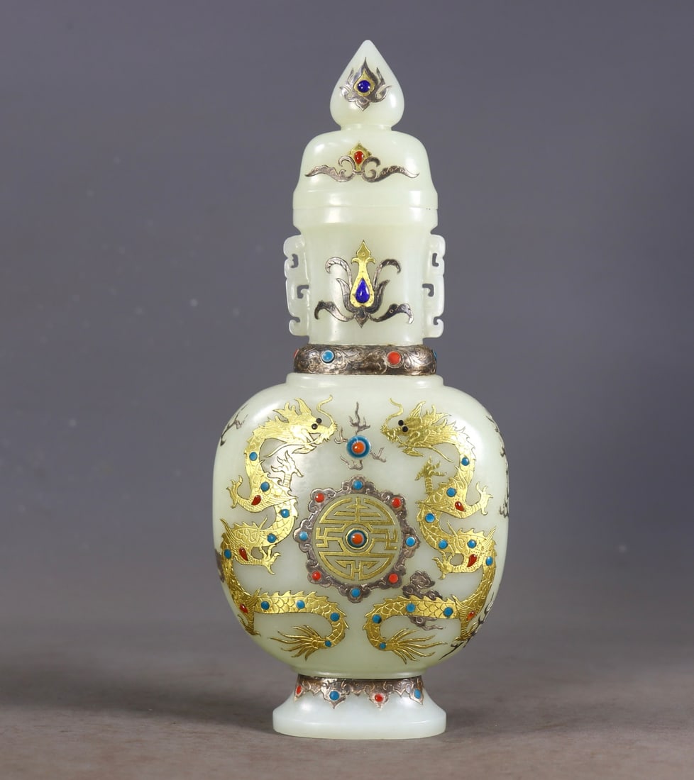 An Exquisite White Jade Inlaid Gold and Silver Inlaid Gems Dragon Pattern Double-Ears Vase: An Exquisite White Jade Inlaid Gold and Silver Inlaid Gems Dragon Pattern Double-Ears Vase Qing Dynasty, China Size: 8.7inx3.5inx1.8in Weight:411g白玉错金银镶॔