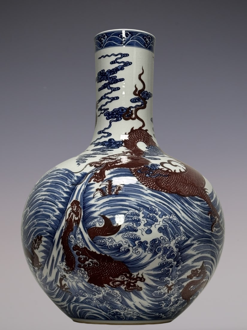 An Exquisite Blue and White Underglaze-Red Dragon Pattern Seawater Pattern Vase: An Exquisite Blue and White Underglaze-Red Dragon Pattern Seawater Pattern Vase Qing Dynasty, China Qianlong Six-character Mark Size:22inx15.4in青花釉里红苍龙