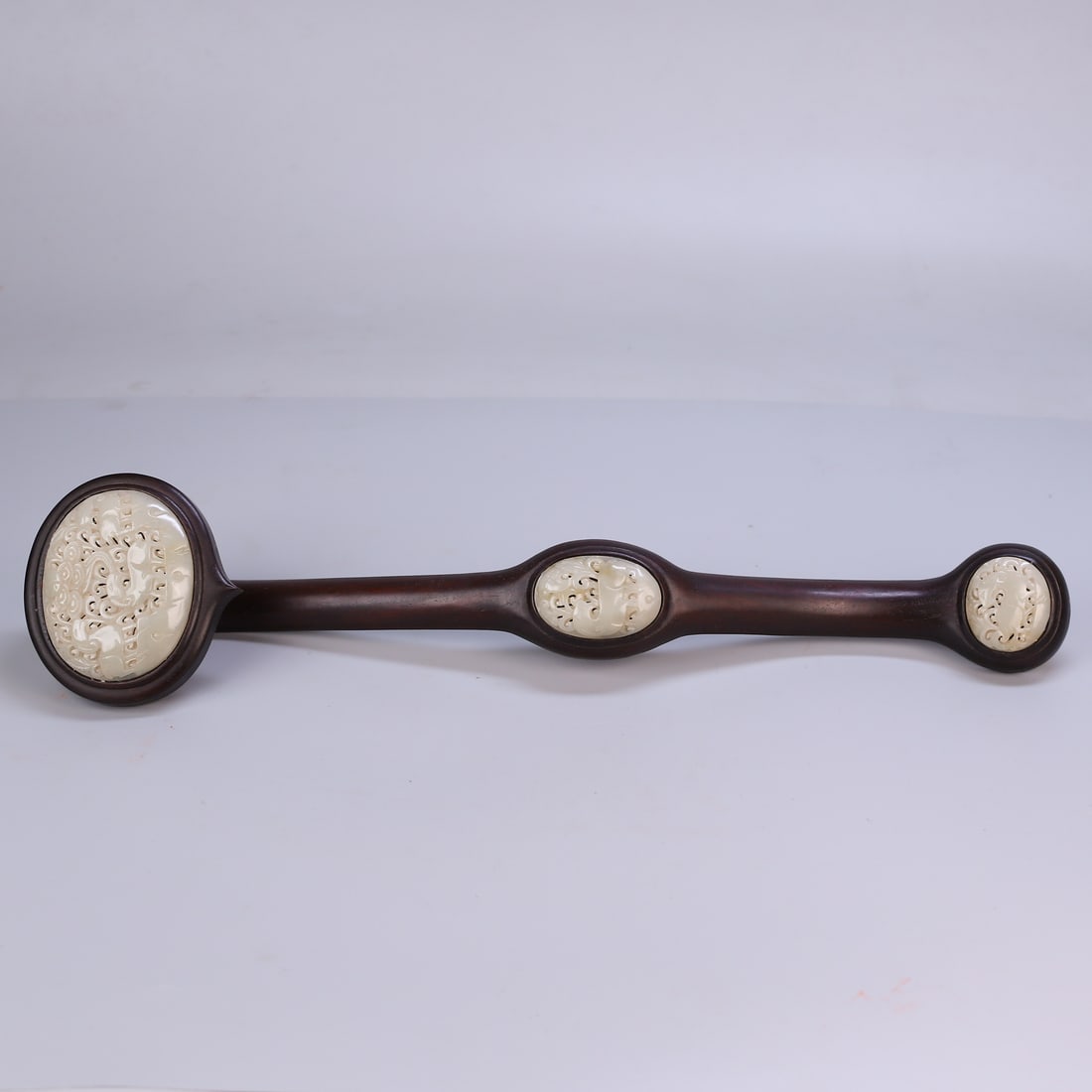 An Exquisite Zitanwood Inlaid White Jade Sheep Pattern Ruyi: An Exquisite Zitanwood Inlaid White Jade Sheep Pattern Ruyi Qing Dynasty, China Size:19.3inx4.3inx3.3in Weight:490g紫檀木嵌白玉如意