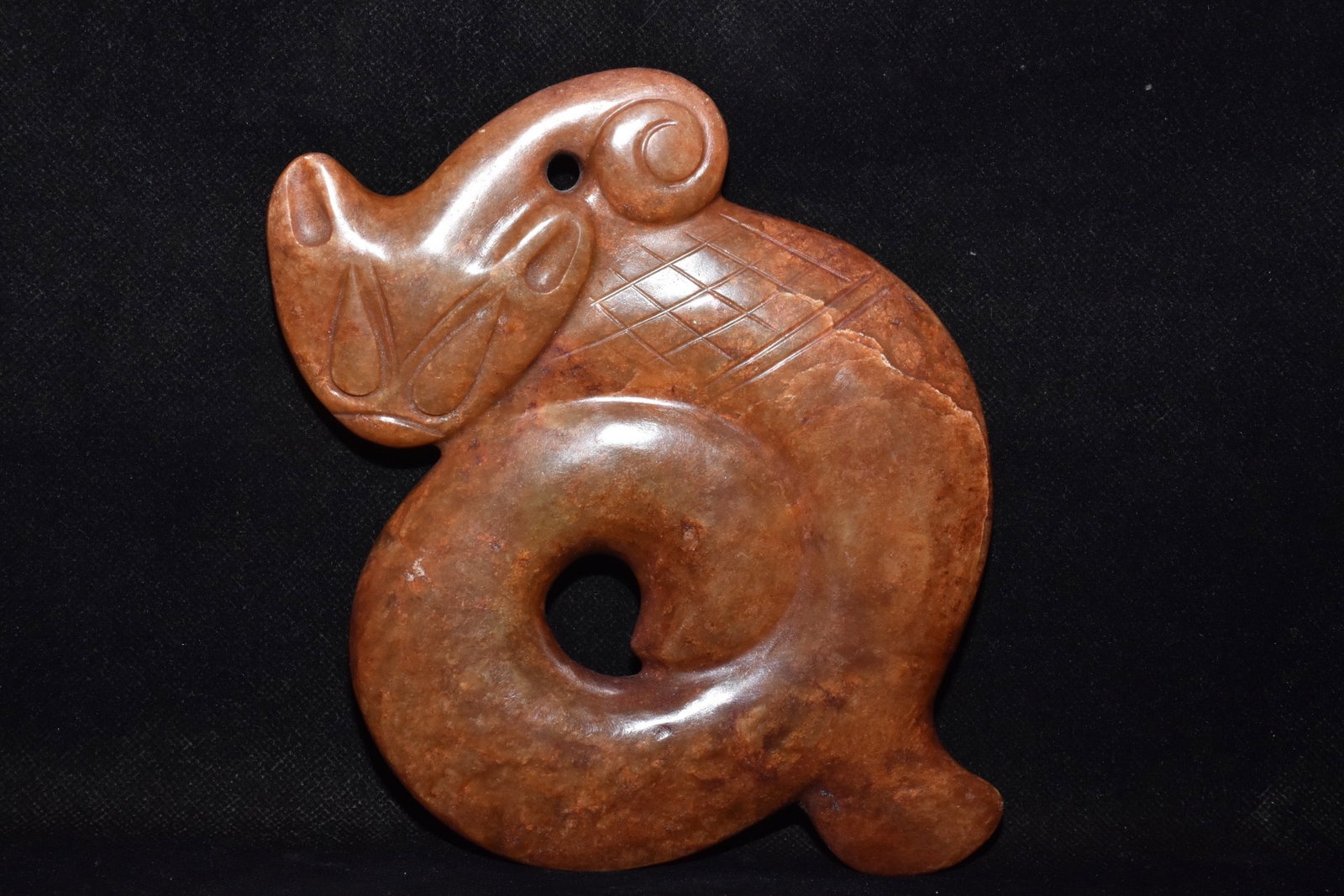 An Exquisite Hemo Jade Dragon Ornament: An Exquisite Hemo Jade Dragon Ornament Hong Shan Culture Size:6.5inx5.9in Weight:710g河磨玉龙 红山文化 Size:16.5cmx15cm Weight:710g