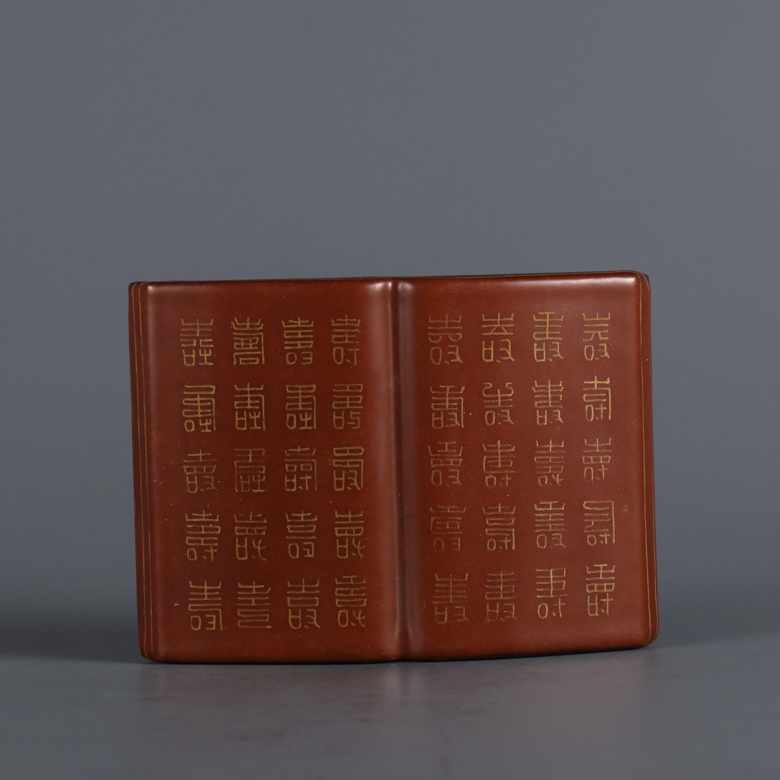 An Exquisite Iron-Red Painted Gold Ornament: An Exquisite Iron-Red Painted Gold Ornament Qing Dynasty, China Size:3.5inx2.6in矾红底描金百寿图书本 中国清代