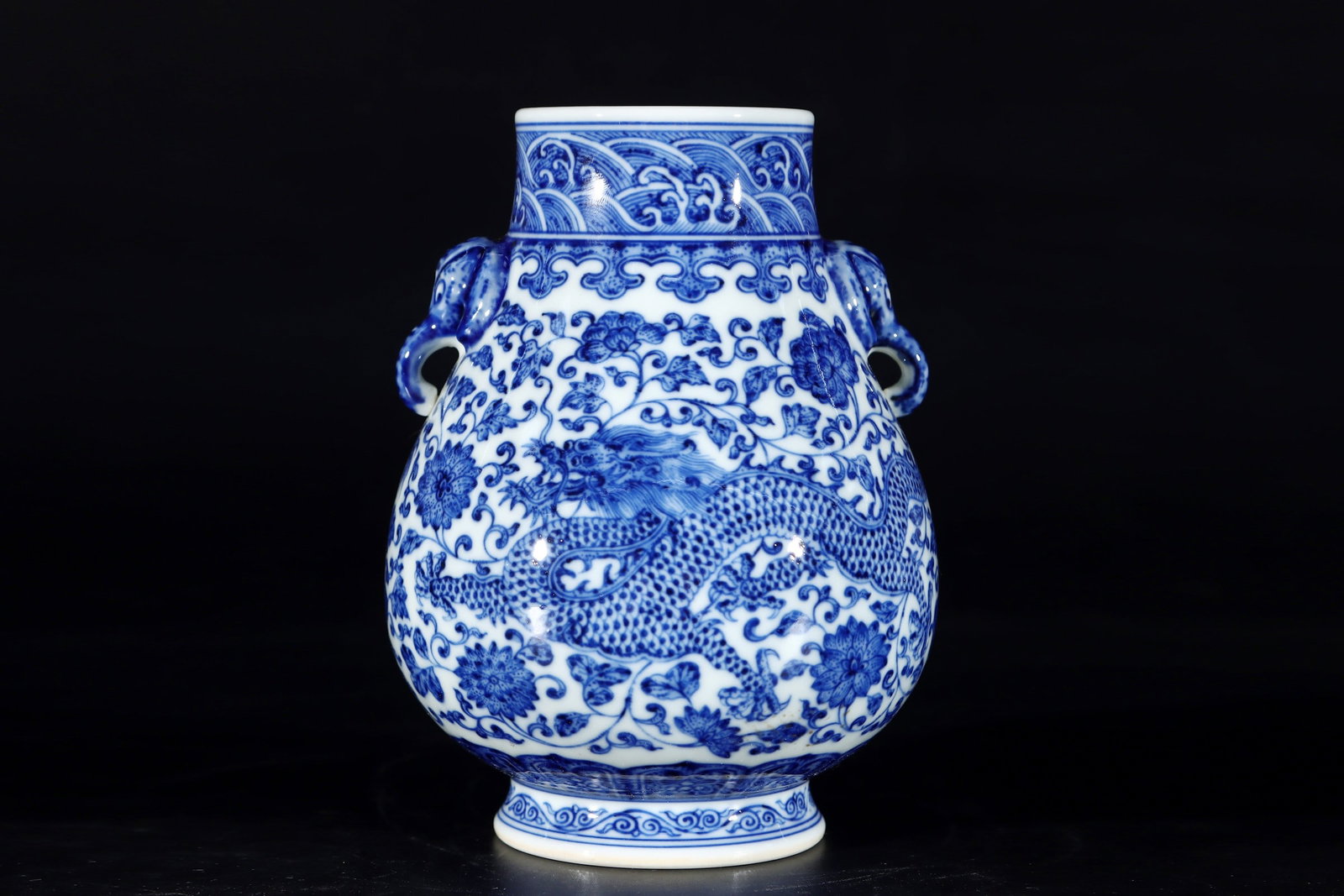 An Exquisite Blue and White Lotus Pattern Seawater Pattern Dragon Pattern Double-Ears Vase: An Exquisite Blue and White Lotus Pattern Seawater Pattern Dragon Pattern Double-Ears Vase Qing Dynasty, China Qianlong Six-character Mark Size:6.2inx4.5in青花龙穿缠ĉ