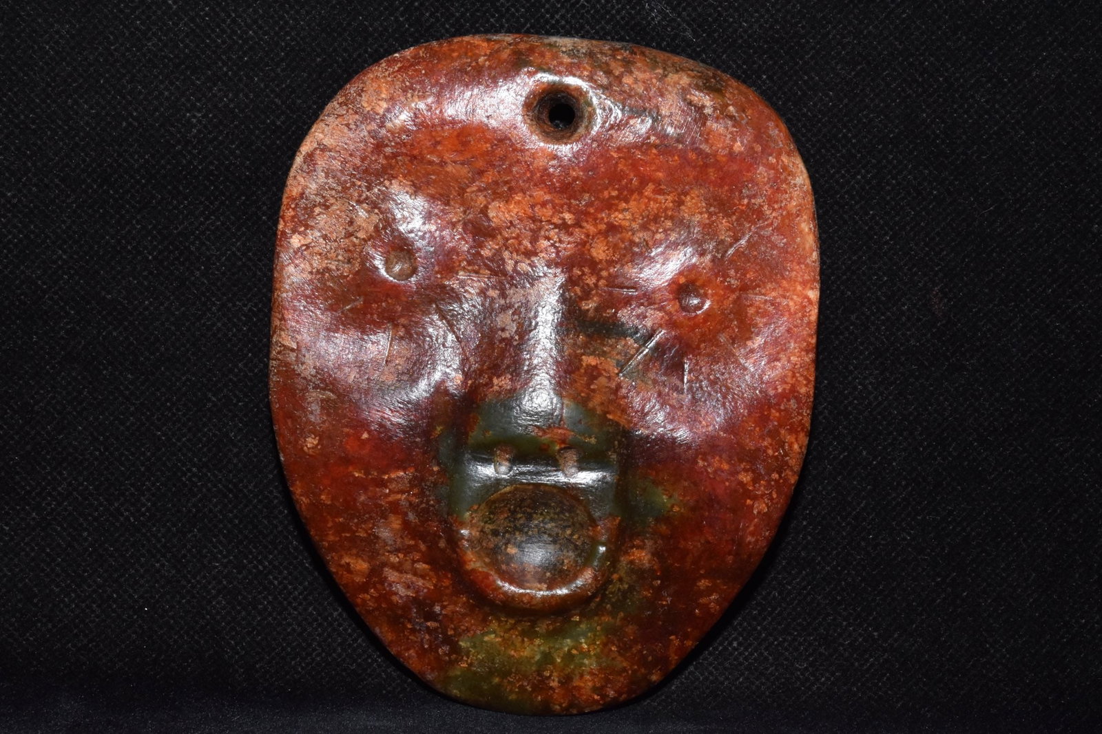 An Exquisite Hemo Jade Ornament: An Exquisite Hemo Jade Ornament Hong Shan Culture Size:4.7inx3.7in Weight:360g河磨玉脸谱 红山文化 Size:12cmx9.5cm Weight:360g