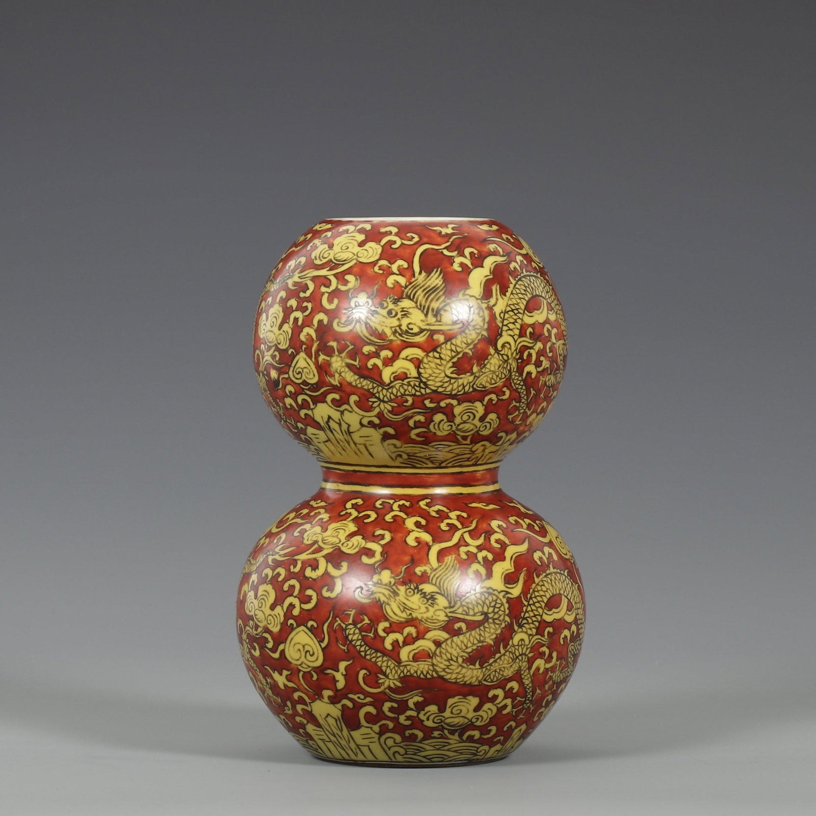 An Exquisite Red Ground Yellow Glazed Auspicious Cloud and Dragon Pattern Gourd-Shaped Vase: An Exquisite Red Ground Yellow Glazed Auspicious Cloud and Dragon Pattern Gourd-Shaped Vase,Ming Dynasty,China,Jiajing Six-character Mark,Size:7.2inx4.7in
