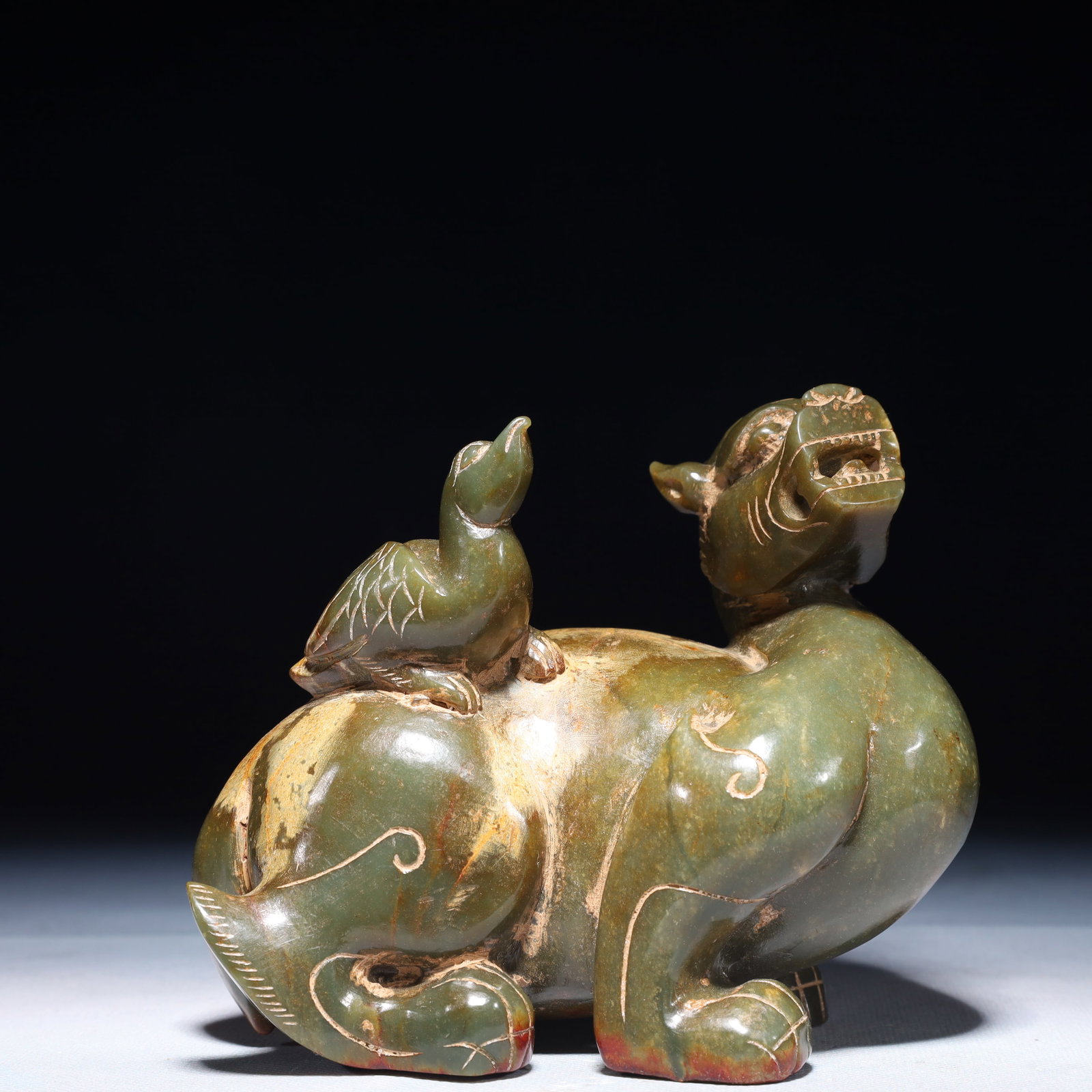 An Exquisite Jasper Auspicious Beast Ornament: An Exquisite Jasper Auspicious Beast Ornament,Qing Dynasty,China,Size:5.5inx3.1inx4.7in,Weight:1750g 碧玉瑞兽摆件,中国清代
