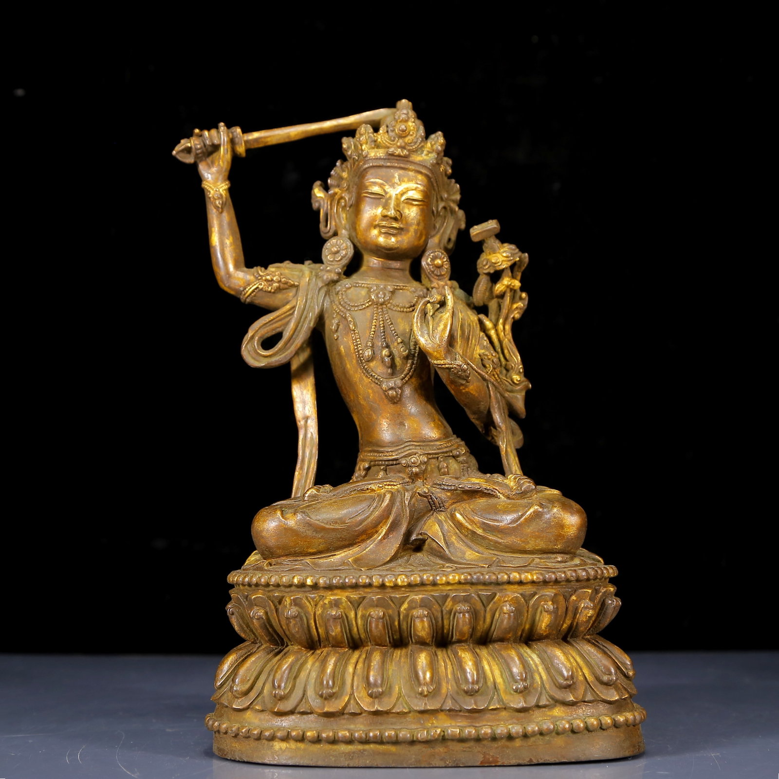A Solemn Gilt Bronze Statue of Manjusri: A Solemn Gilt Bronze Statue of Manjusri,Ming Dynasty, China,Size:6.3inx4.7inx10.2in,Weight:3495g 铜鎏金文殊菩萨像，明代