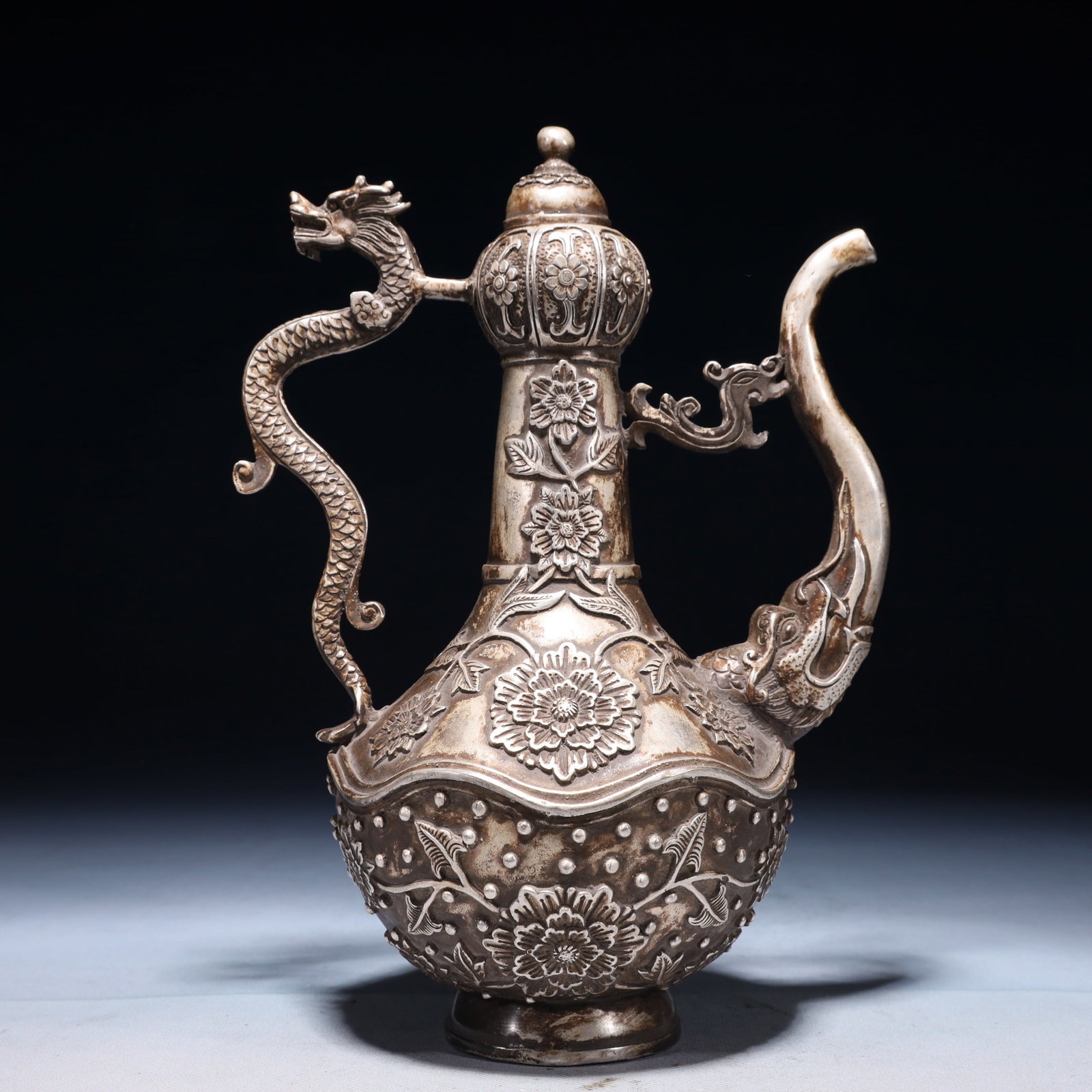 An Exquisite Silver-plated Bronze Flower Pattern Ewer: An Exquisite Silver-plated Bronze Flower Pattern Ewer,Qing Dynasty,China,Qianlong Four-character Mark,Size:7.1inx4.7inx9.8in,Weight:1300g