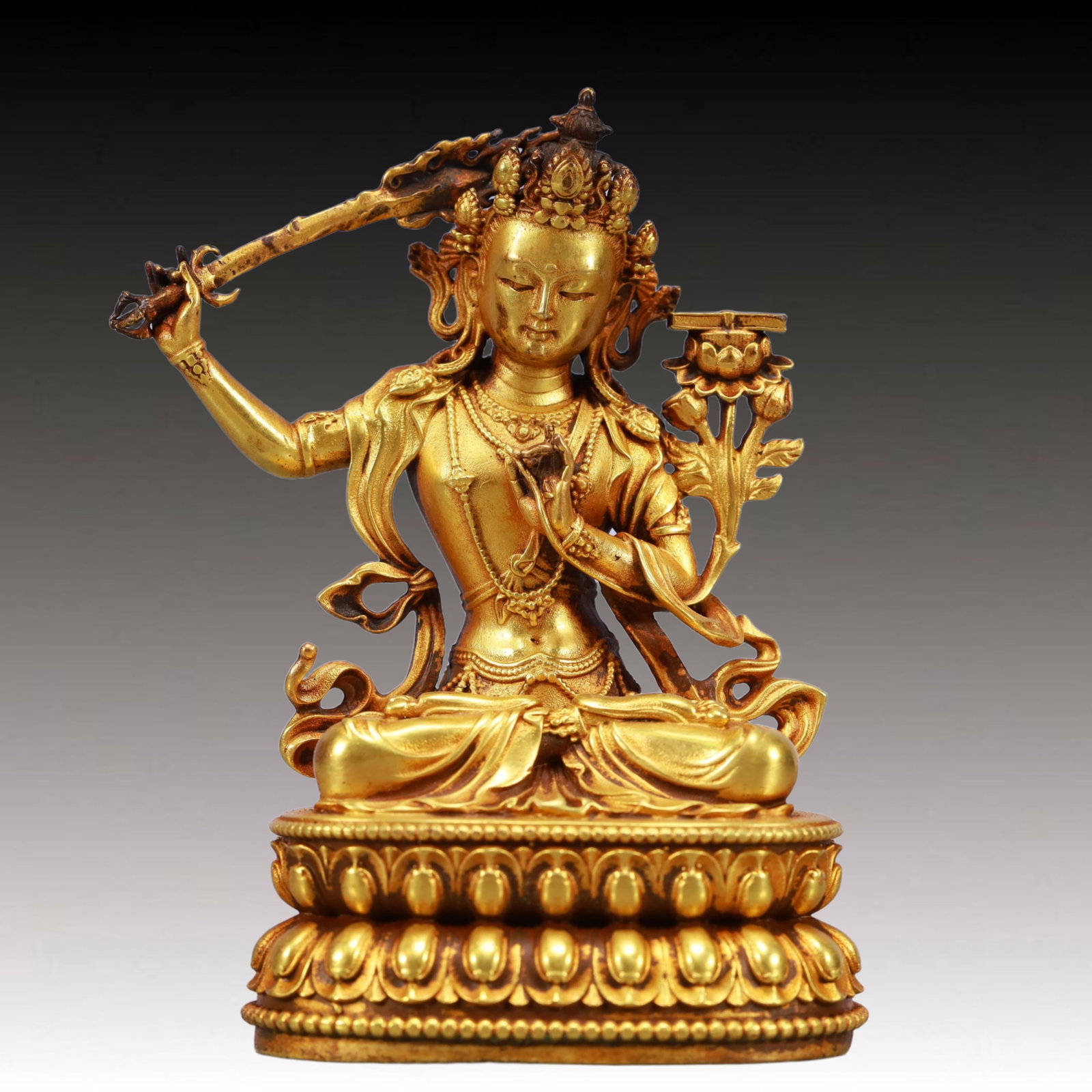 A Solemn Gilt Bronze Statue of Manjusri: A Solemn Gilt Bronze Statue of Manjusri,Ming Dynasty, China,Yongle Six-character Mark,Size:2.4inx1.8inx3.7in,Weight:560g 铜鎏金文殊菩萨像,中ࢲ