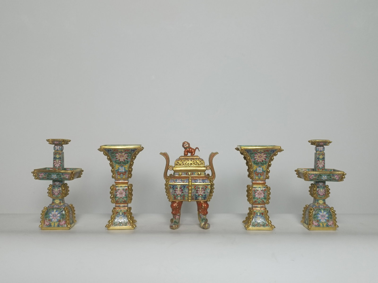 A Set of Fine Enamel Painted Gold Lotus Pattern Ornaments: A Set of Fine Enamel Painted Gold Lotus Pattern Ornaments,Qing Dynasty,China,Qianlong Four-character Mark,Size:(Censer)10.2inx6.1in,(Vase)9.5inx5in,(Candlestick)10.2inx4.7in