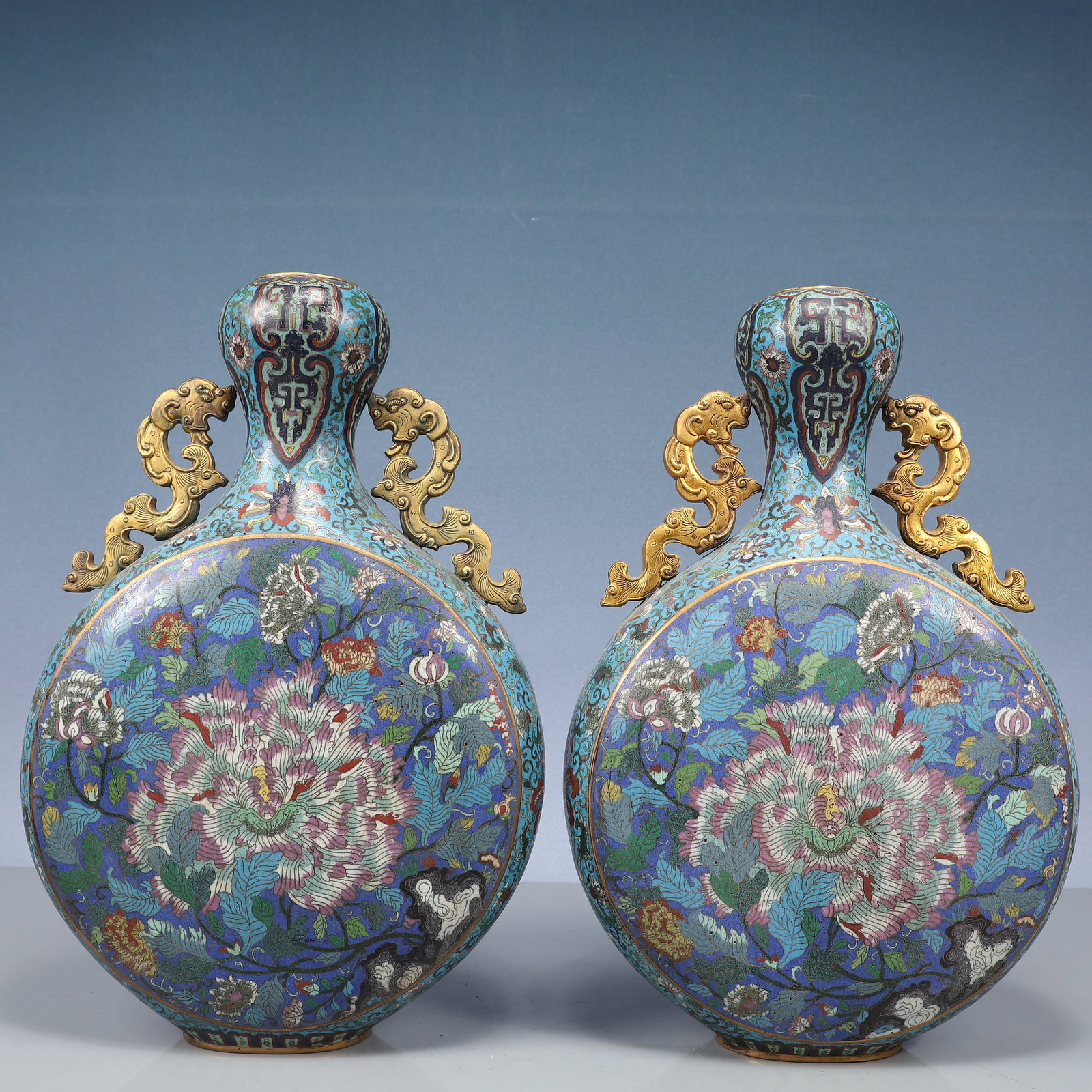 A Pair of Huge Cloisonne Flower Pattern Dragon-Ears Vases: A Pair of Huge Cloisonne Flower Pattern Dragon-Ears Vases,Qing Dynasty, China,Qianlong Four-character Mark,Size:15.9inx9.8inx3.5in,Weight:6200g 一对景泰蓝花卉