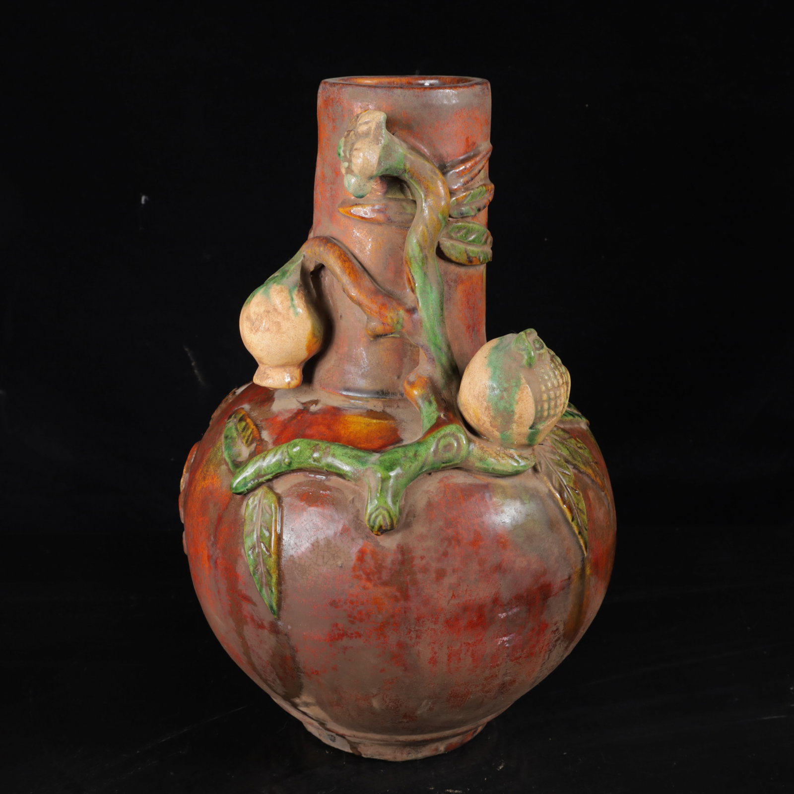 An Exquisite Tang Tri-Color Glazed Pottery Flower and Fruit Pattern Vase: An Exquisite Tang Tri-Color Glazed Pottery Flower and Fruit Pattern Vase,Tang Dynasty,China,Size:15inx9.8inx9.8in,Weight:3220g 唐三彩花果纹瓶,中国