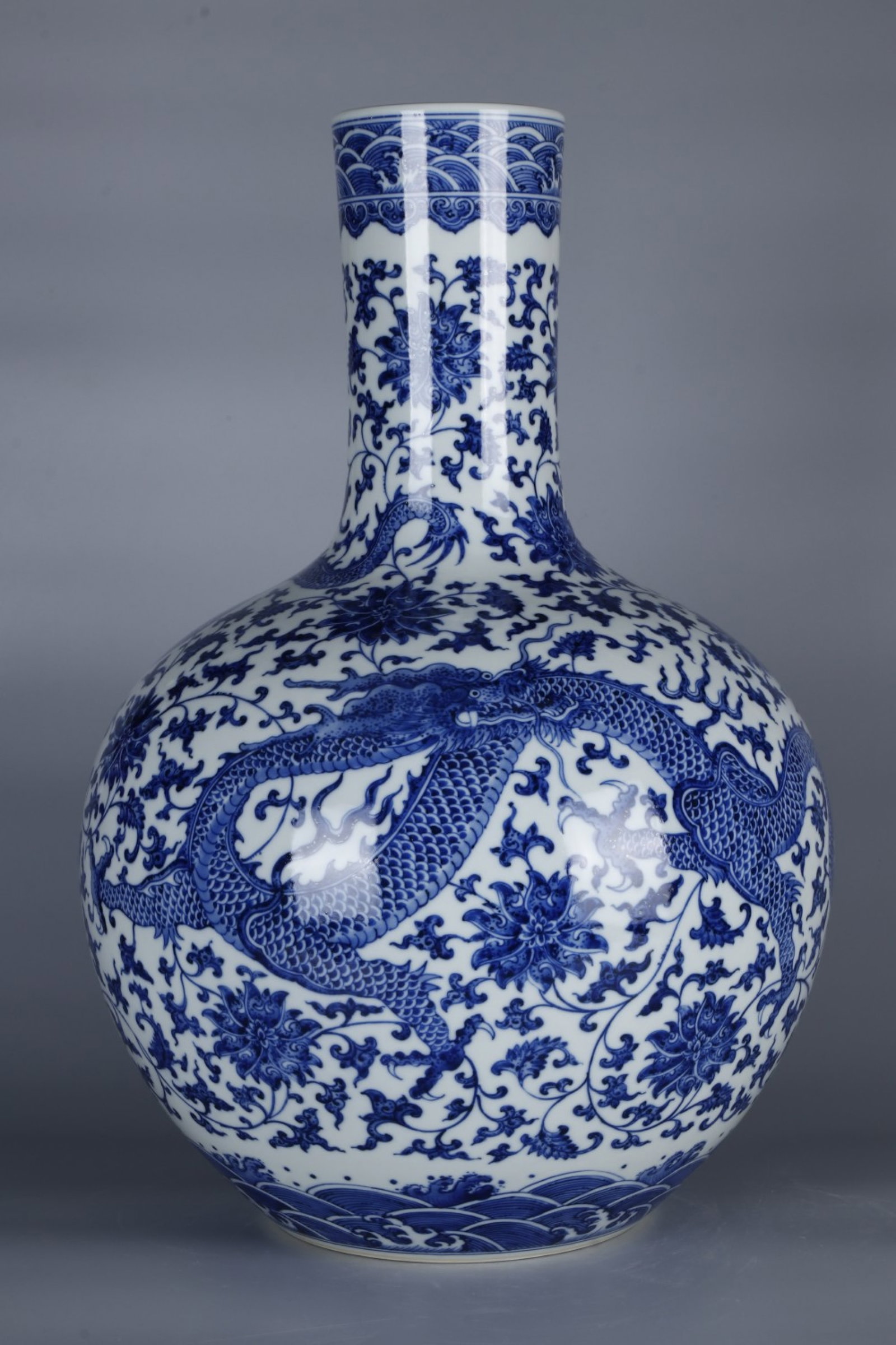 An Exquisite Blue and White Lotus and Dragon Pattern Vase: An Exquisite Blue and White Lotus and Dragon Pattern Vase,Qing Dynasty,China,Qianlong Six-character Mark,Size:18.1inx12.2in