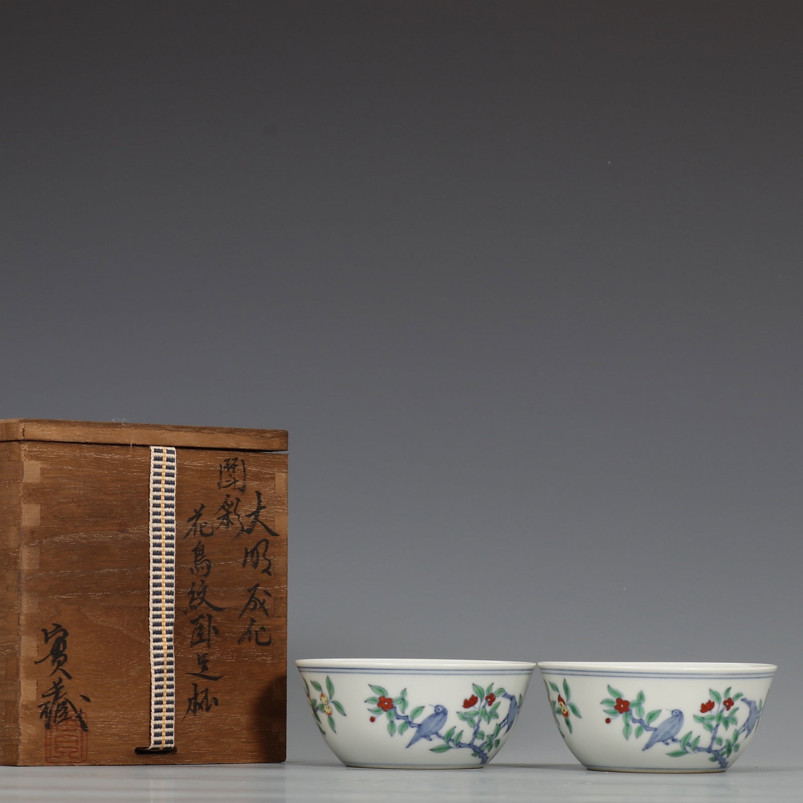 A Pair of Exquisite Doucai Flower and Bird Pattern Cups: A Pair of Exquisite Doucai Flower and Bird Pattern Cups,Ming Dynasty,China,Chenghua Six-character Mark,Size:1.7inx3.7in 一对斗彩花鸟纹杯子,中