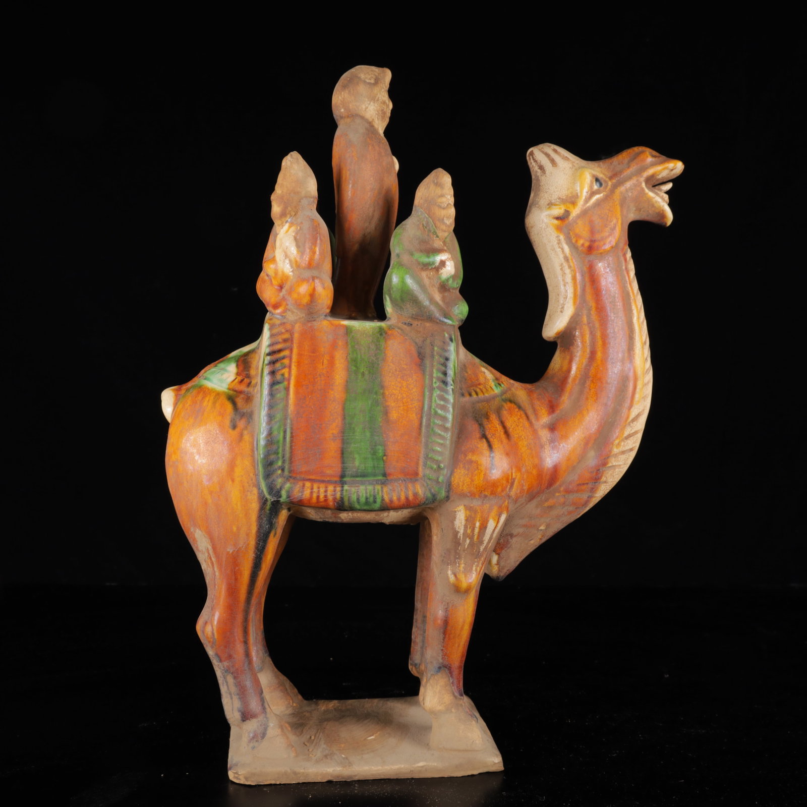 An Exquisite Tang Tri-Color Glazed Pottery Figure Pattern Camel Ornament: An Exquisite Tang Tri-Color Glazed Pottery Figure Pattern Camel Ornament,Tang Dynasty,China,Size:13.8inx10.6inx4.3in,Weight:2000g 唐三彩人物纹骆驼ਇ
