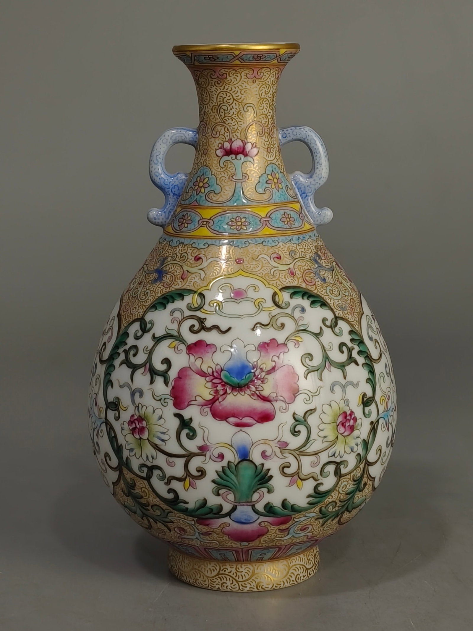 An Exquisite Famille-Rose Flower Pattern Double-Ears Vase: An Exquisite Famille-Rose Flower Pattern Double-Ears Vase,Qing Dynasty,China,Qianlong Four-character Mark,Size:6.7inx4.3in